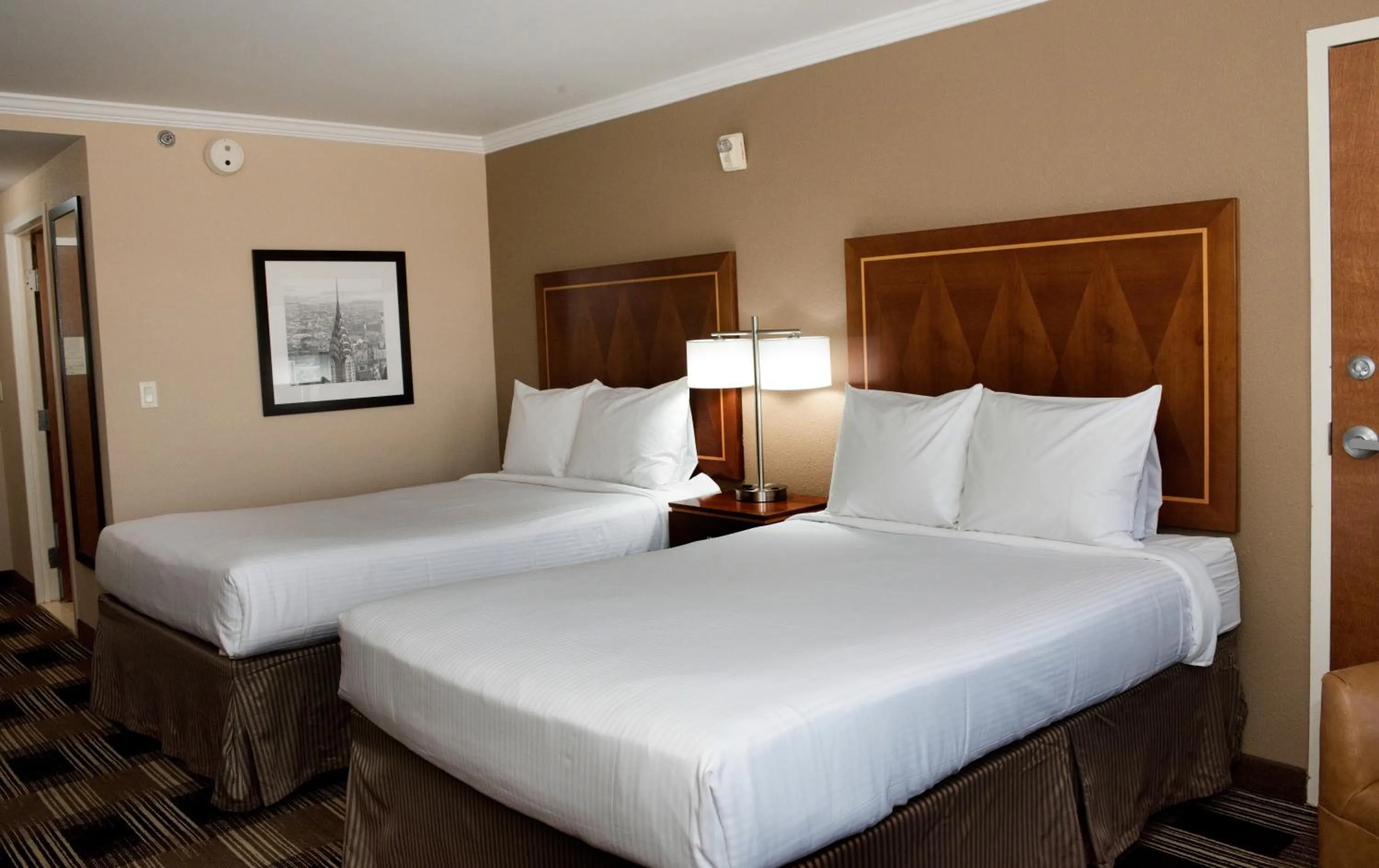 Bed in Hotel Executive Suites