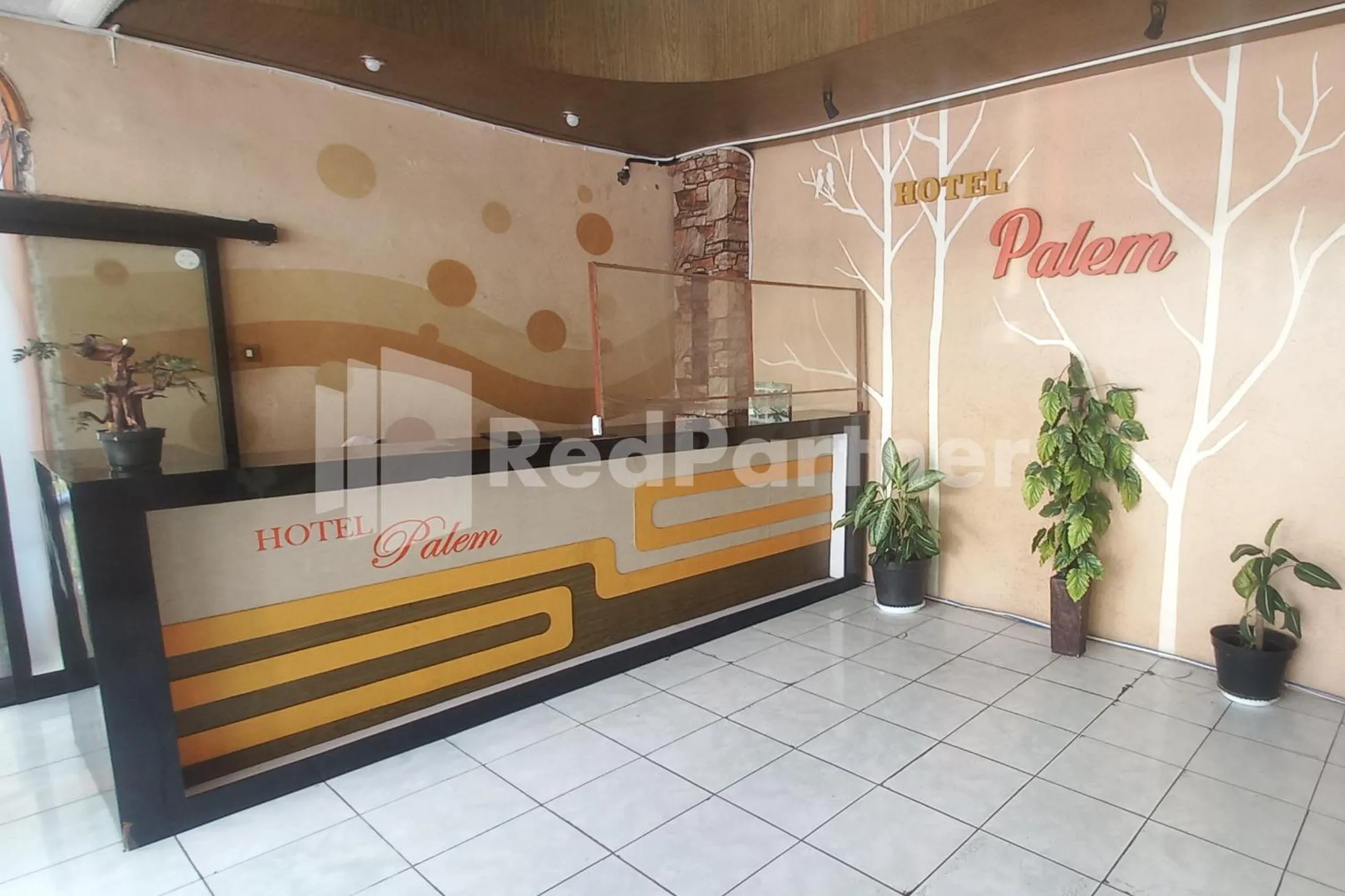 Lobby or reception in Hotel Palem 2 Syariah Malang Redpartner