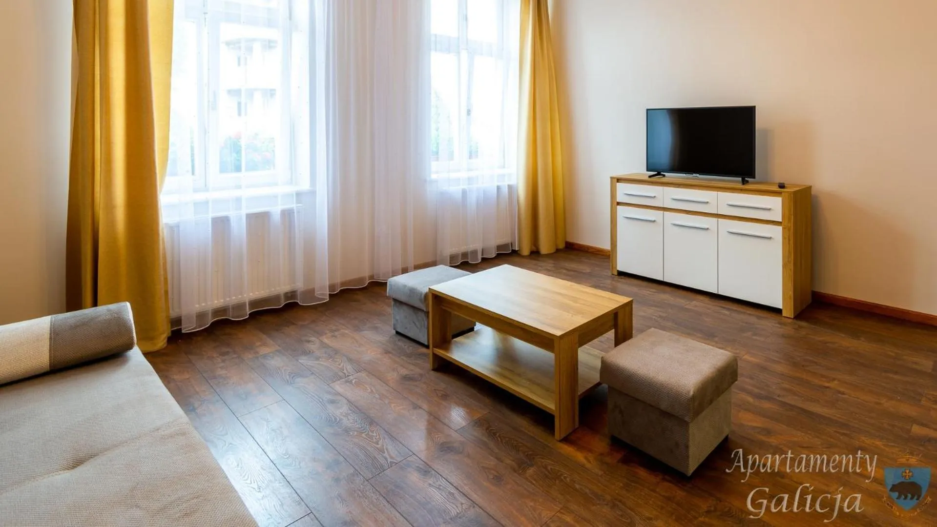 Communal lounge/ TV room in Apartamenty Galicja