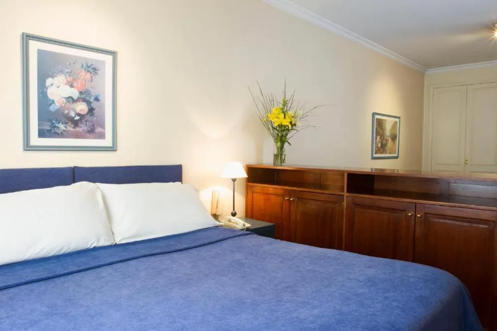 Bed in Mayla Apartments