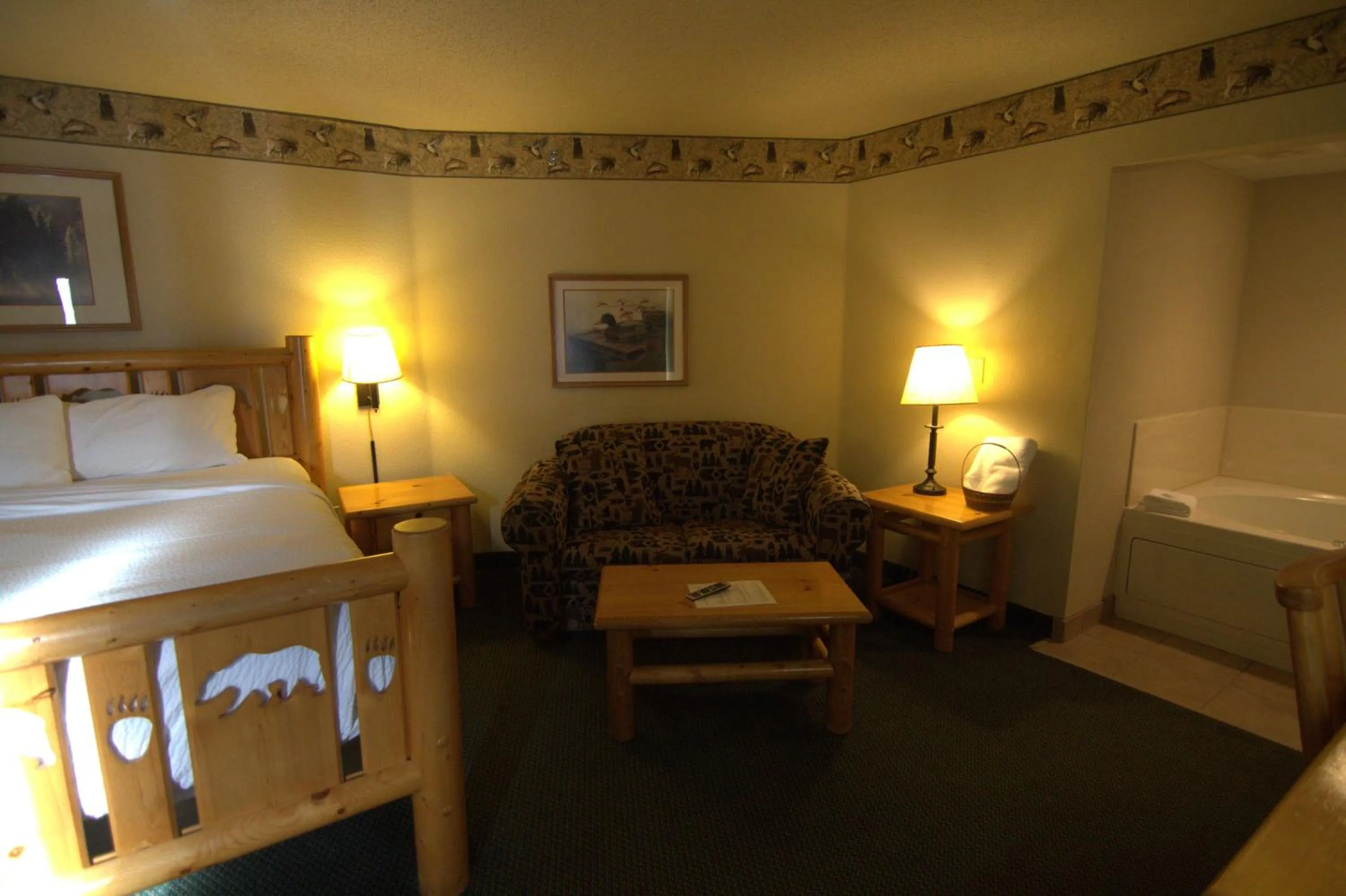 Bed in Shell Lake Lodge, a Travelodge by Wyndham