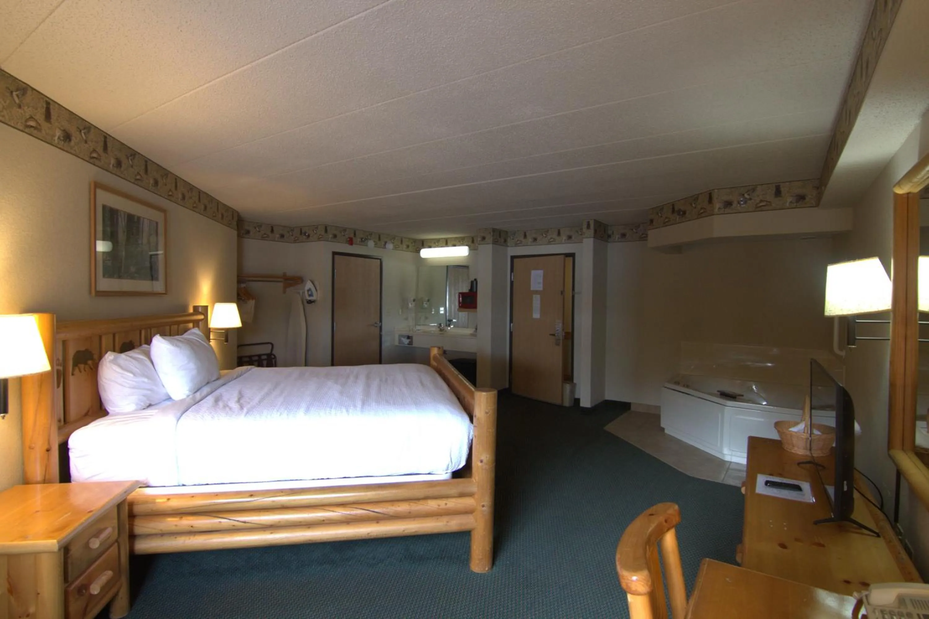 Bed in Shell Lake Lodge, a Travelodge by Wyndham