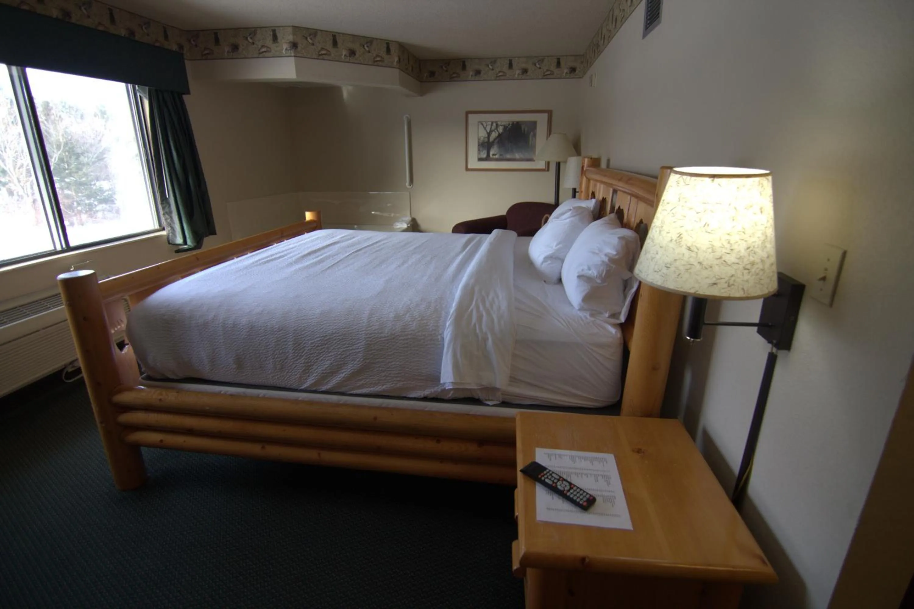 Bed in Shell Lake Lodge, a Travelodge by Wyndham