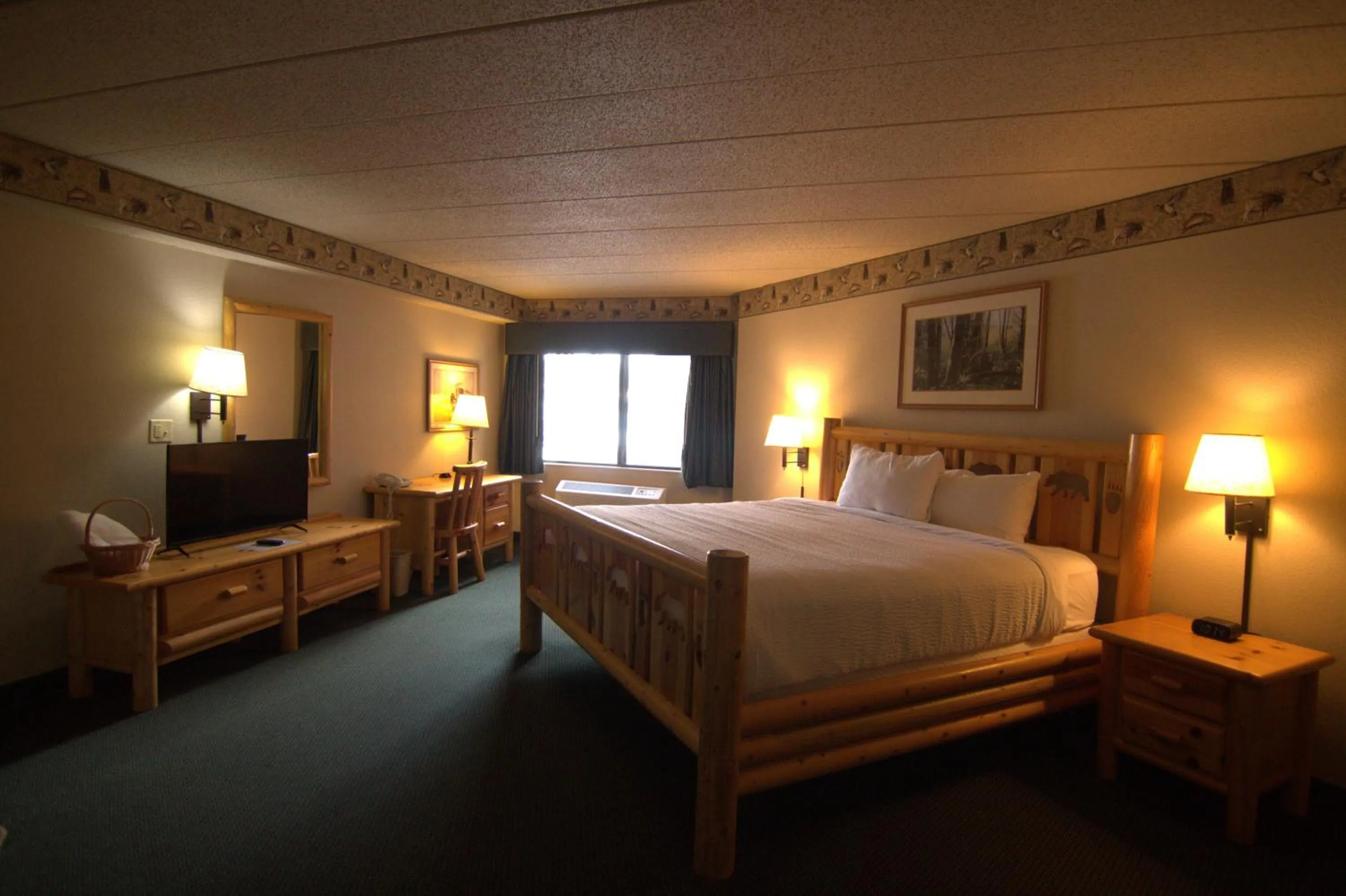Bed in Shell Lake Lodge, a Travelodge by Wyndham