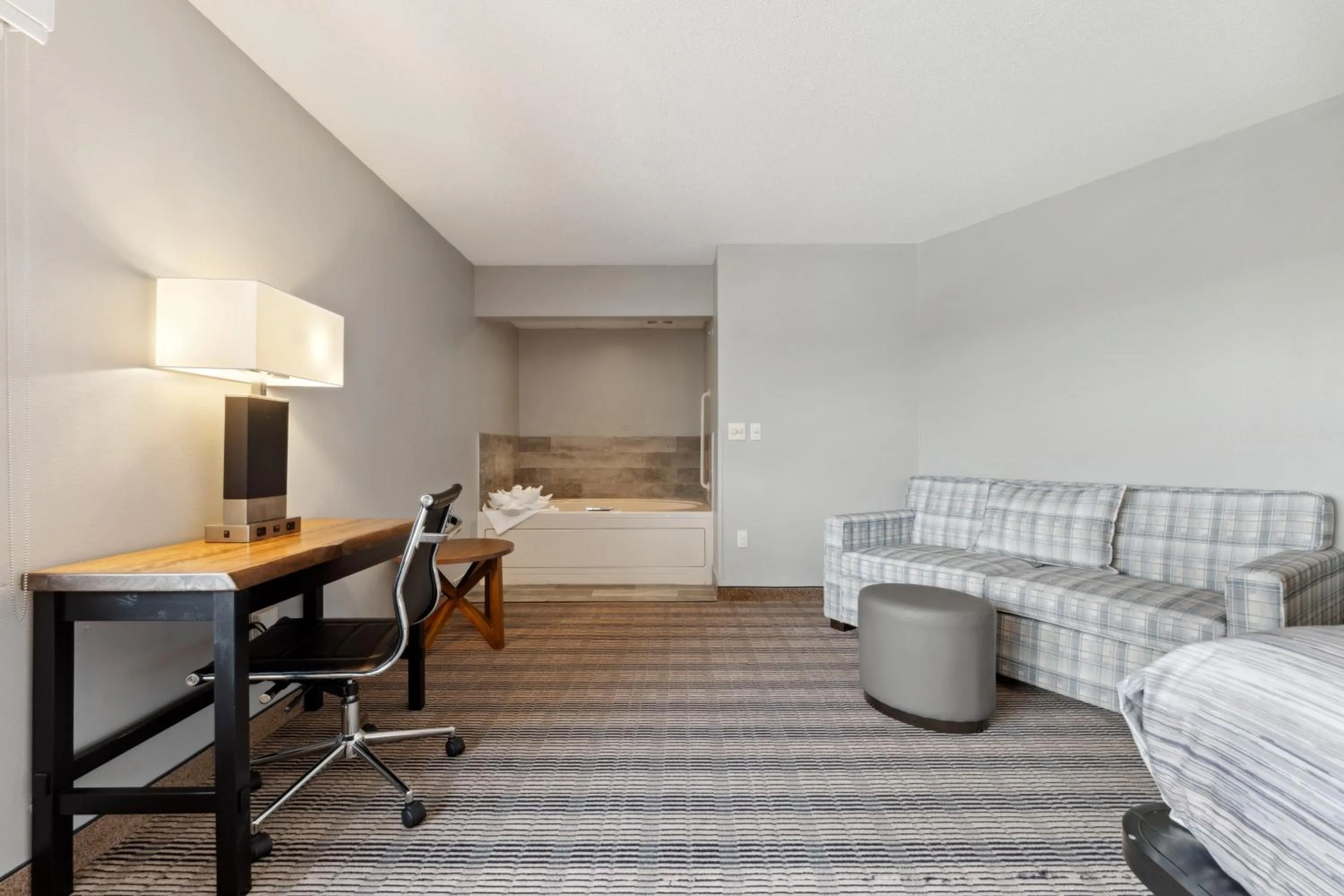 Bed in AmericInn by Wyndham Wisconsin Dells