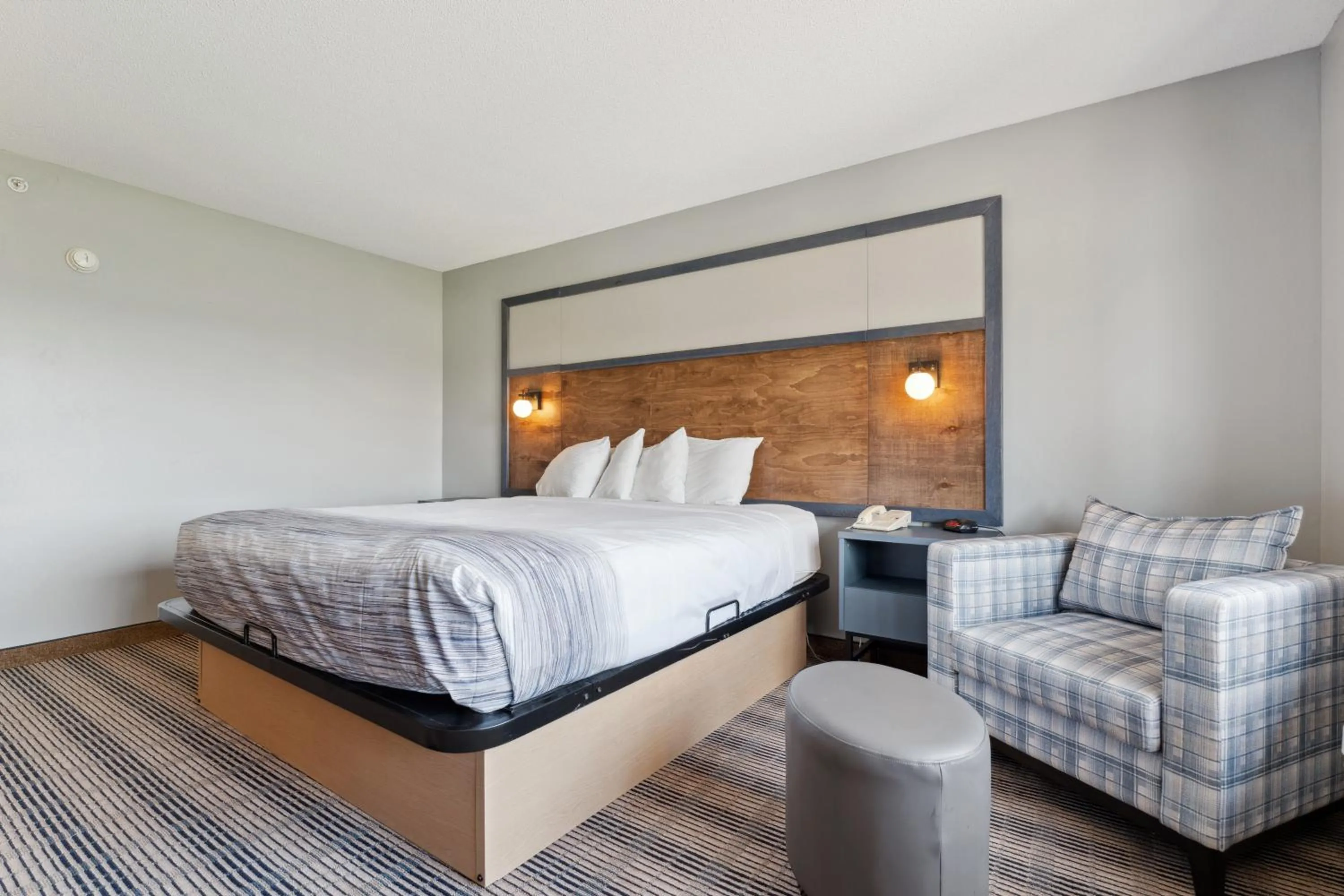 Bed in AmericInn by Wyndham Wisconsin Dells