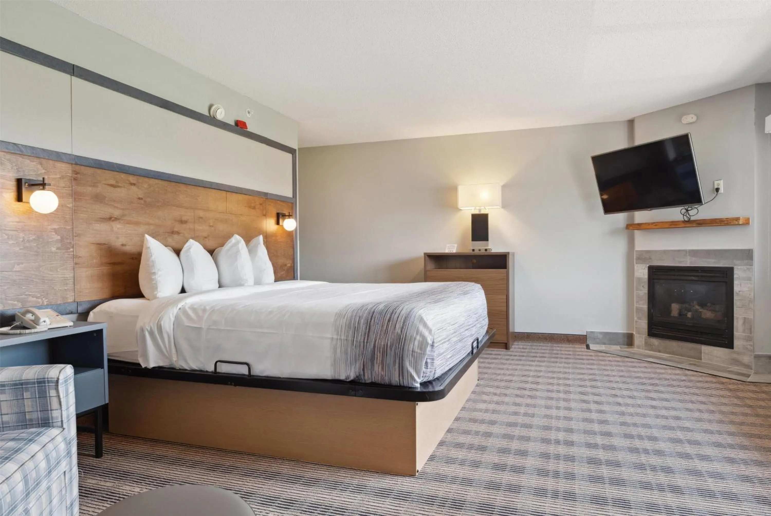 Bed in AmericInn by Wyndham Wisconsin Dells