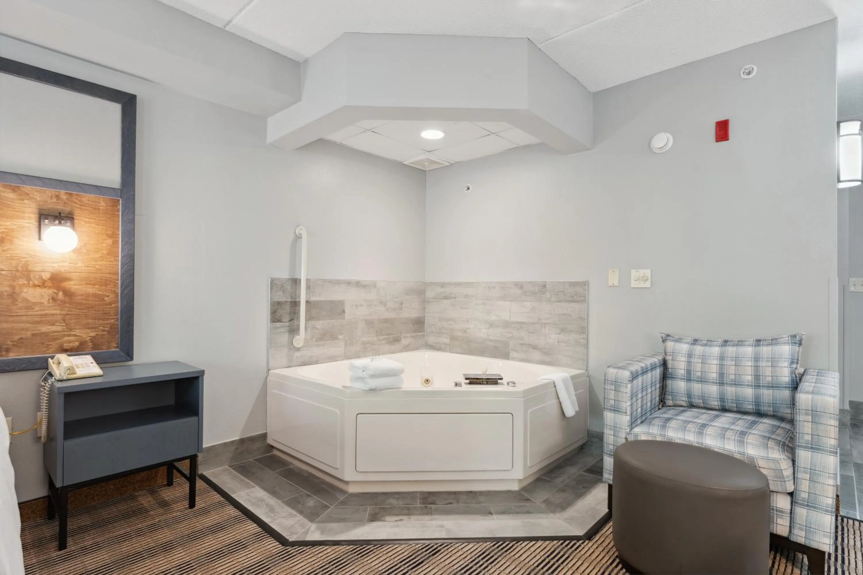 Bed in AmericInn by Wyndham Wisconsin Dells