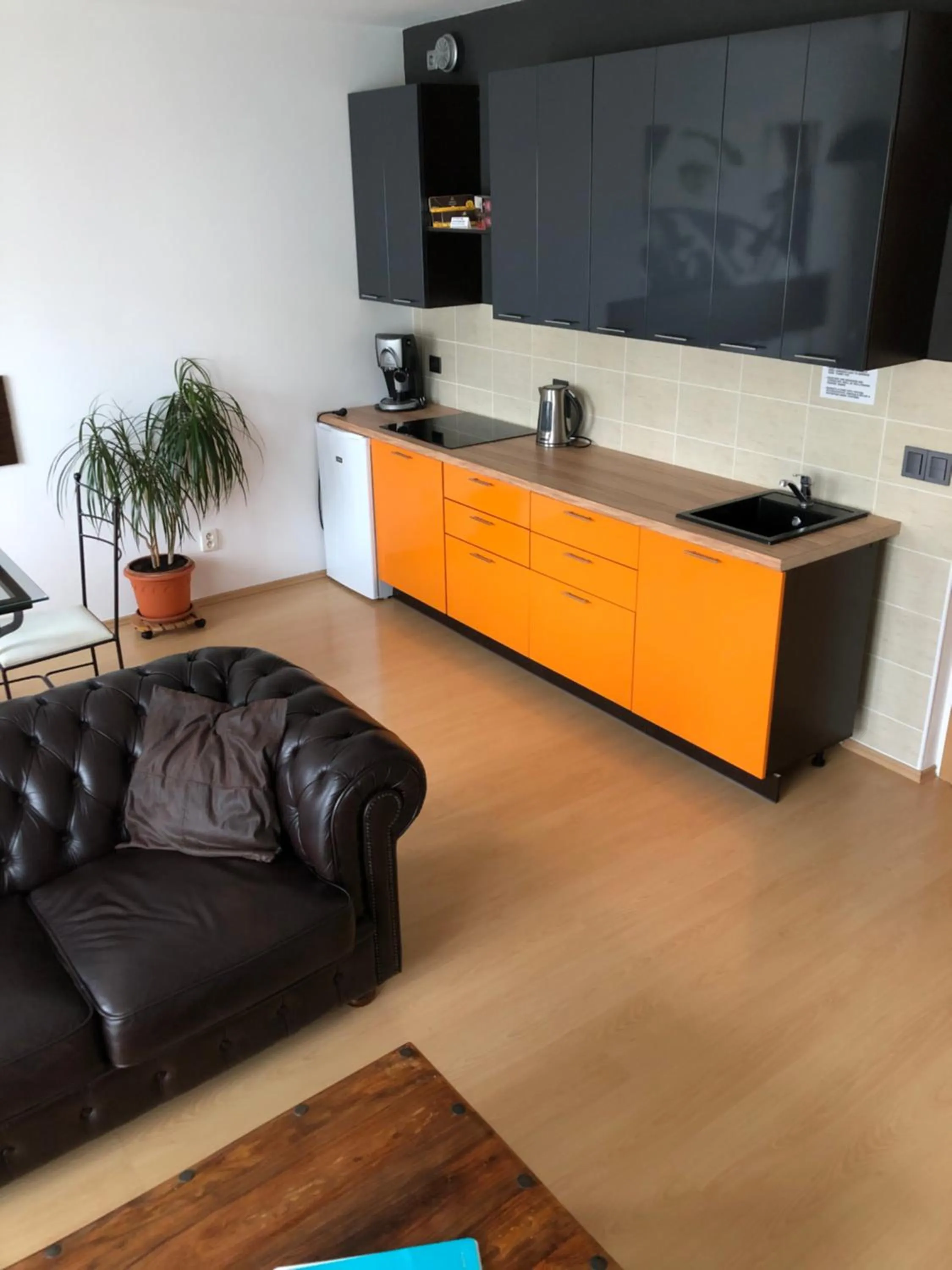 Communal lounge/ TV room in Richie Apartment near Aquapark