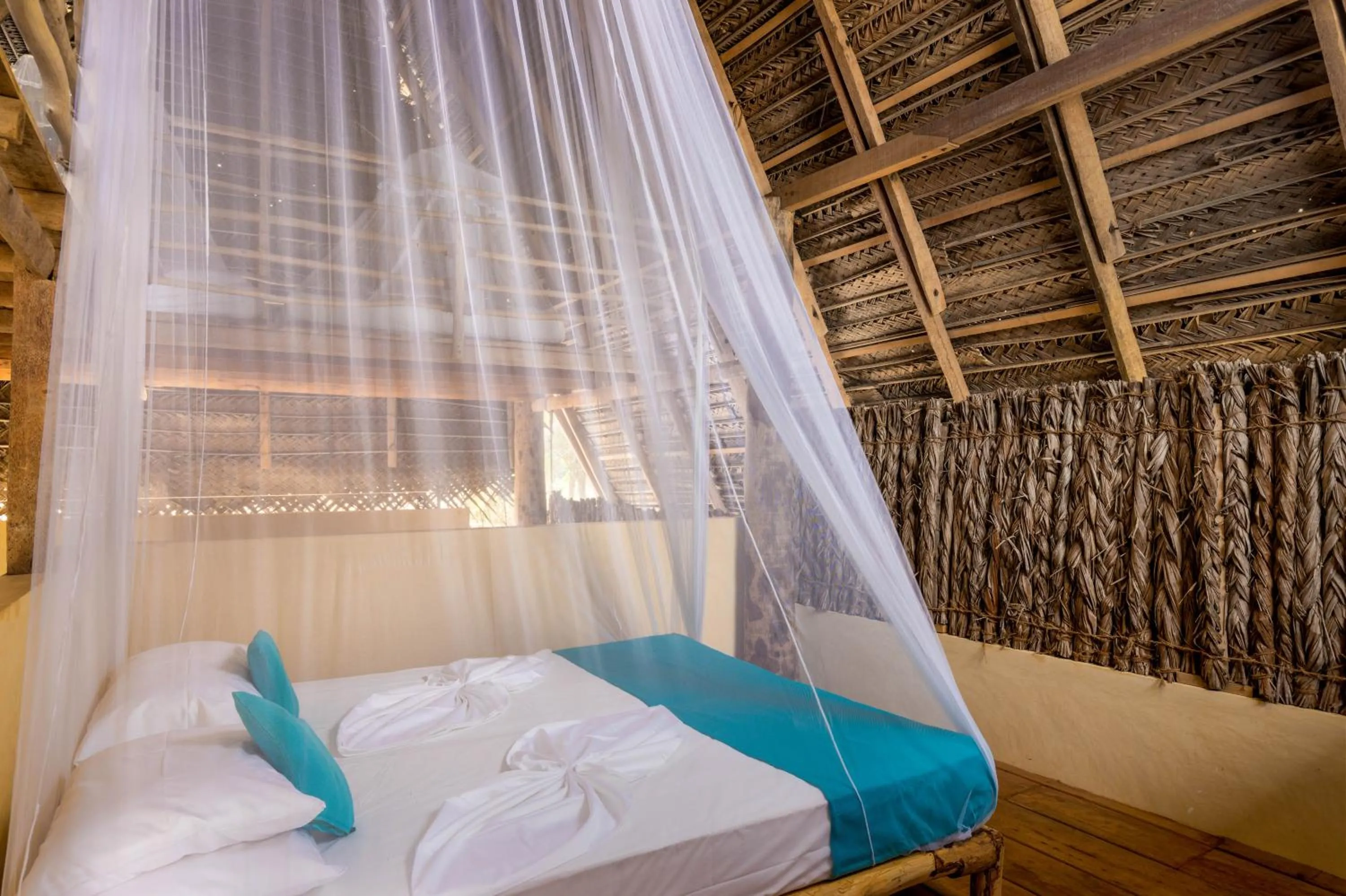 Bed in Elements Beach & Nature Resort