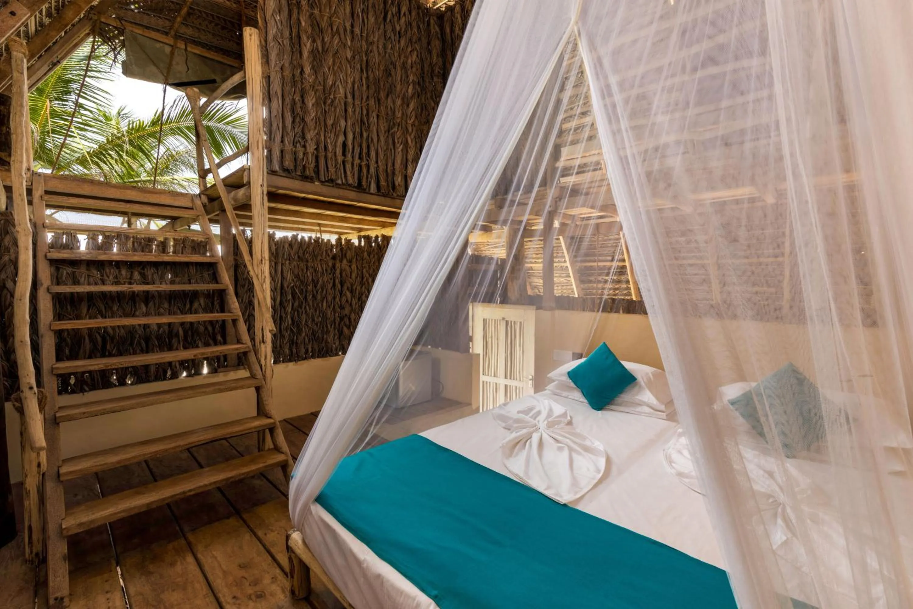 Bed in Elements Beach & Nature Resort