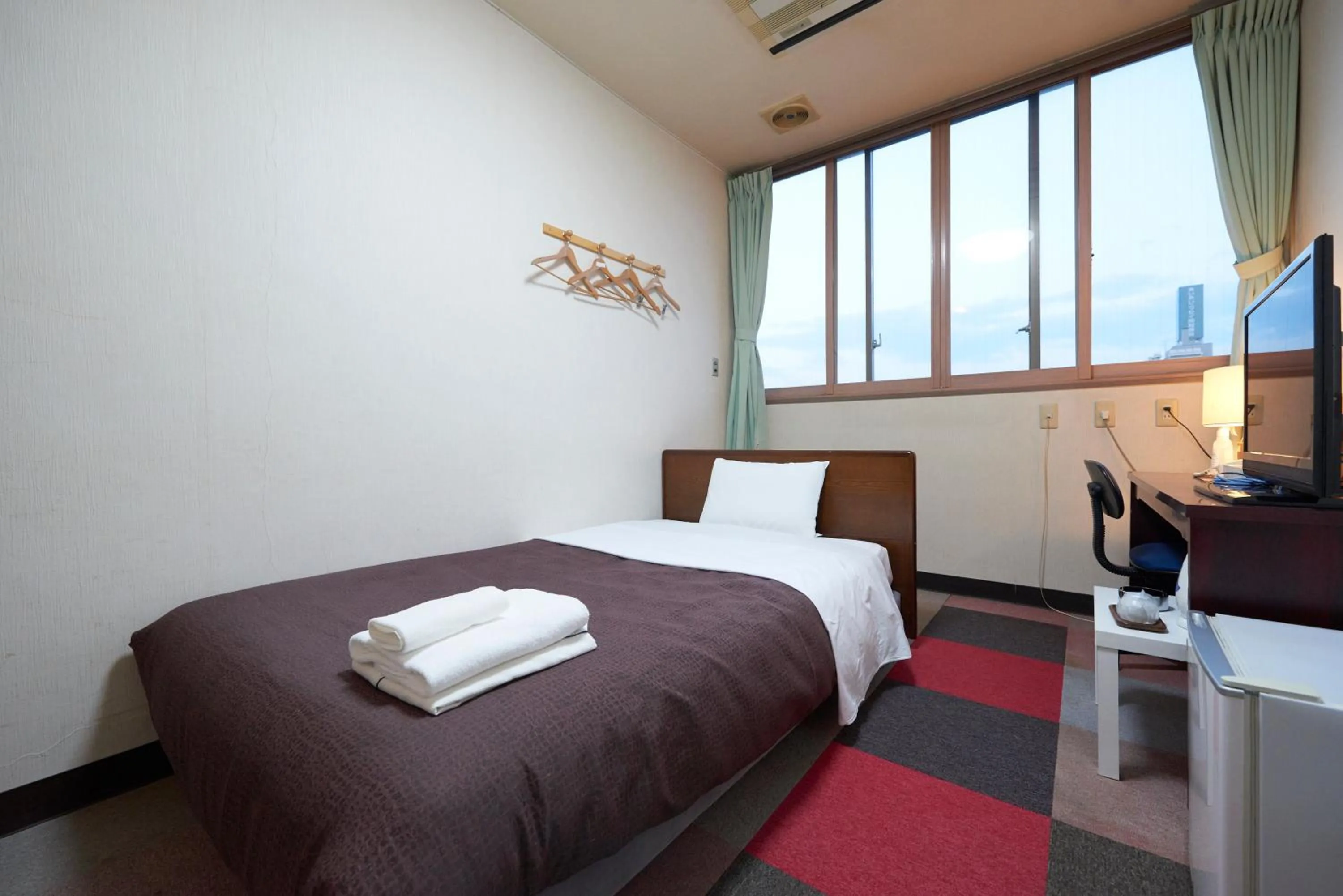 Bed in Hotel Select Inn Furukawa