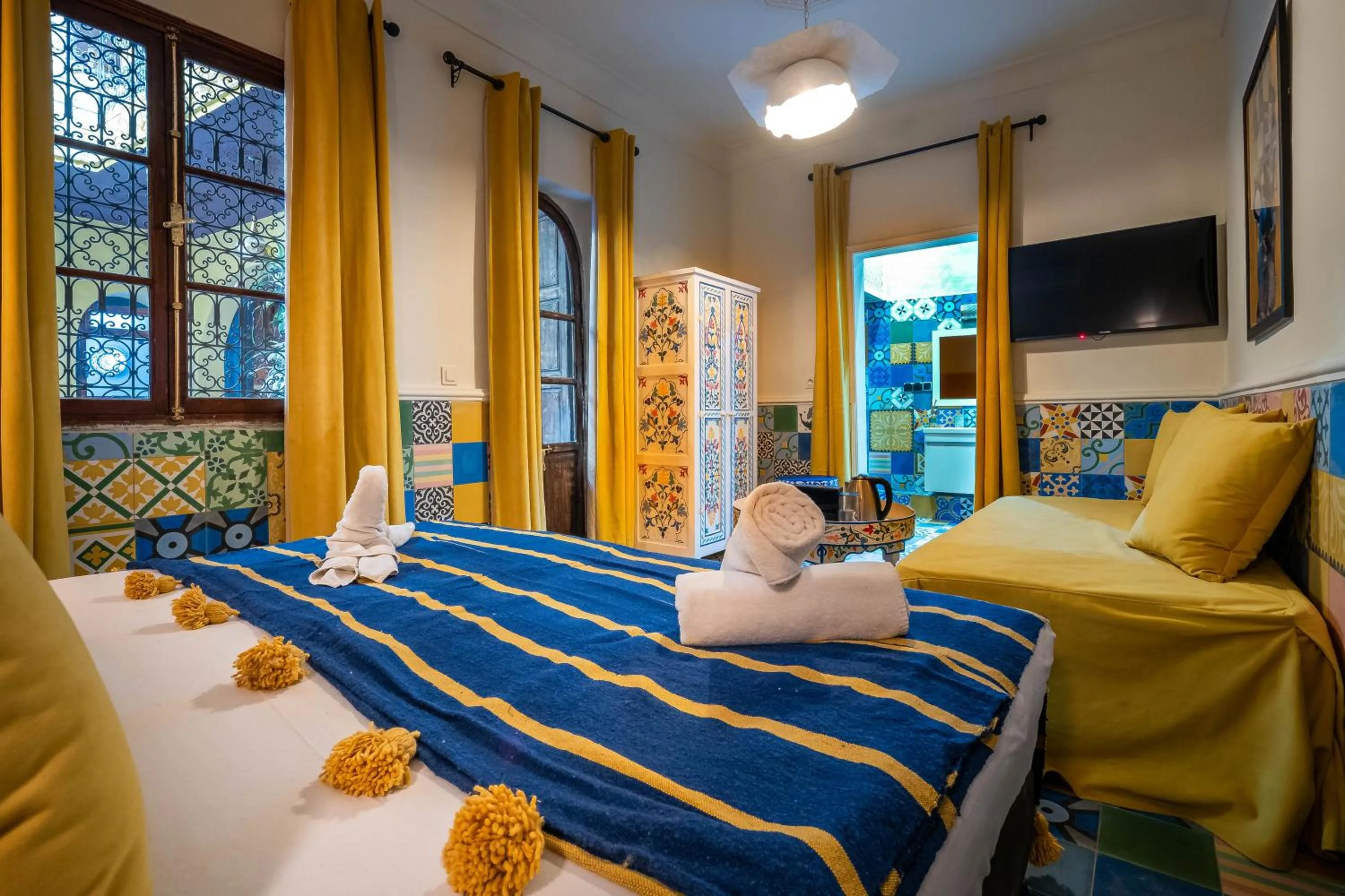 Communal lounge/ TV room, Bed in Dar Khmissa Riad & Spa