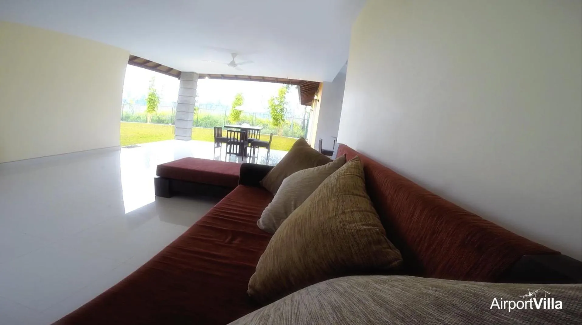 Communal lounge/ TV room in Airport Villa