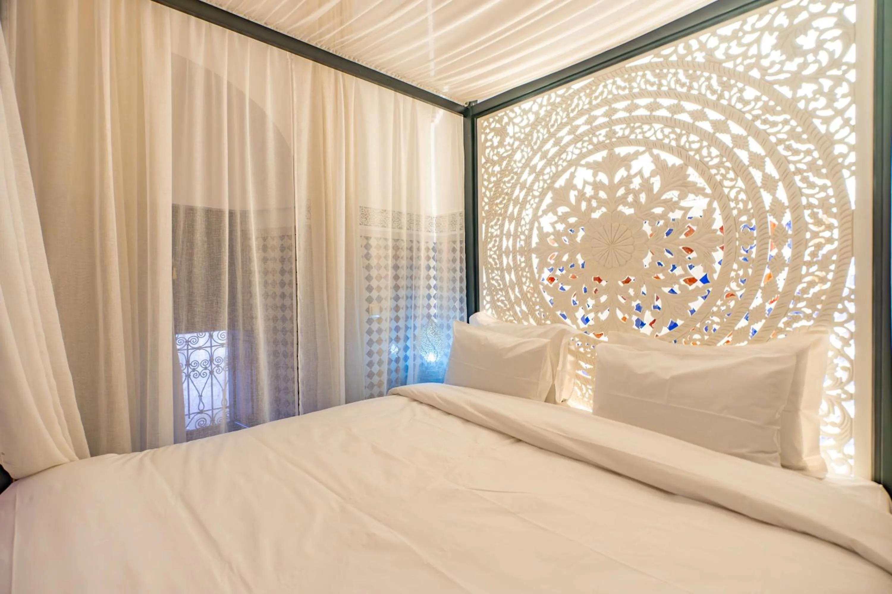 Bed in Riad Dar Dialkoum