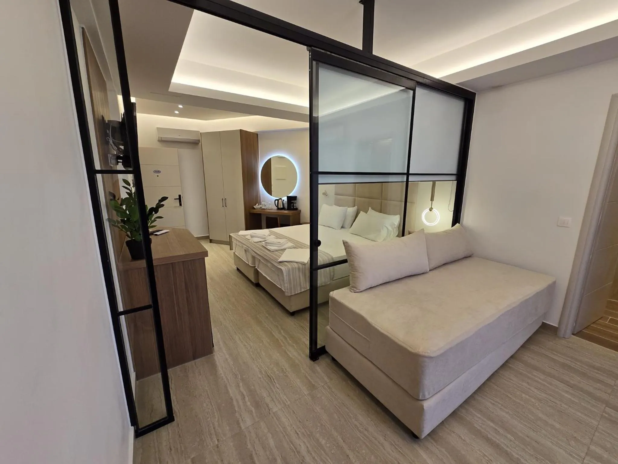 Bed in Theo Beach Hotel Apartments