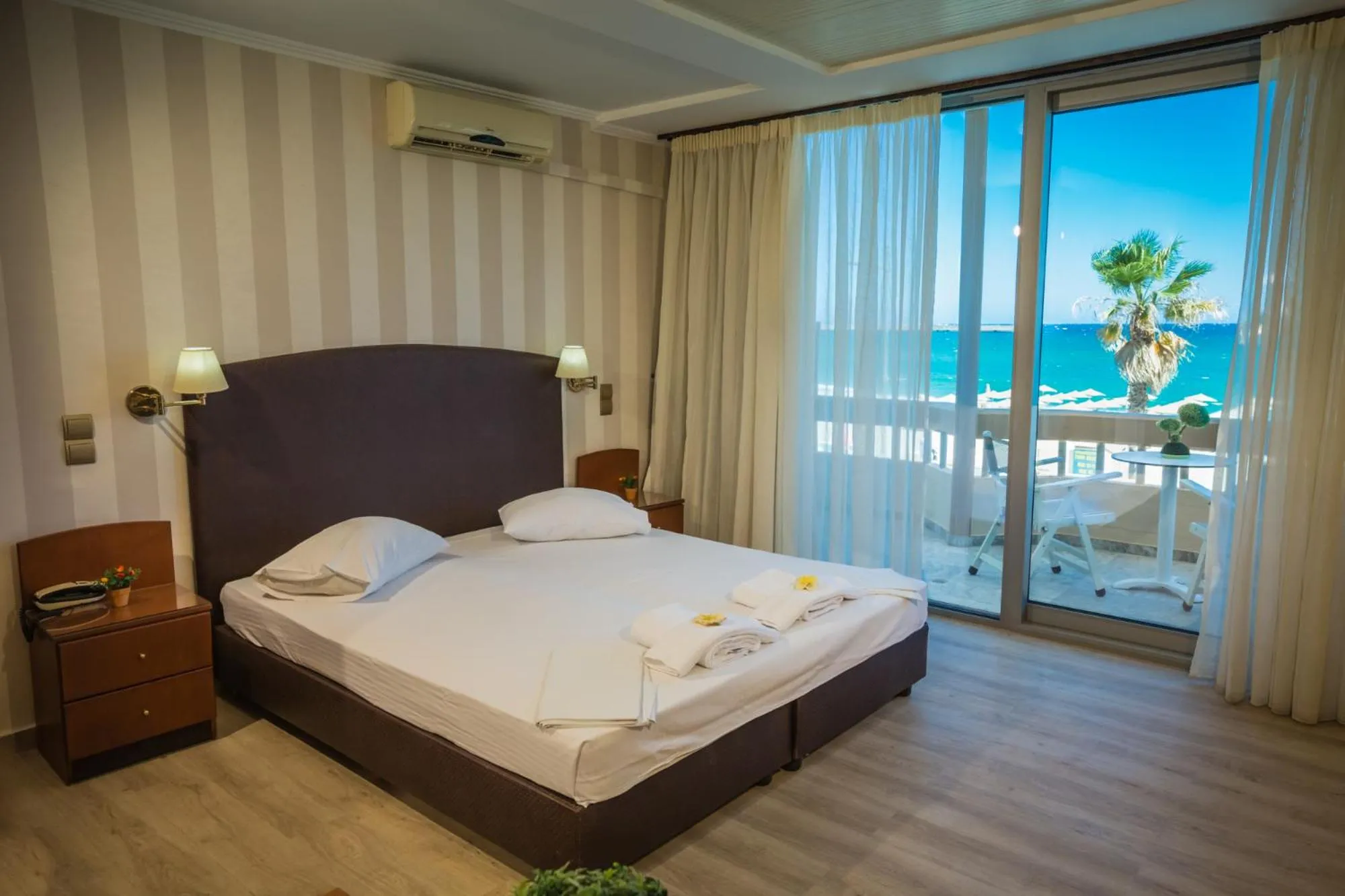 Bed in Theo Beach Hotel Apartments