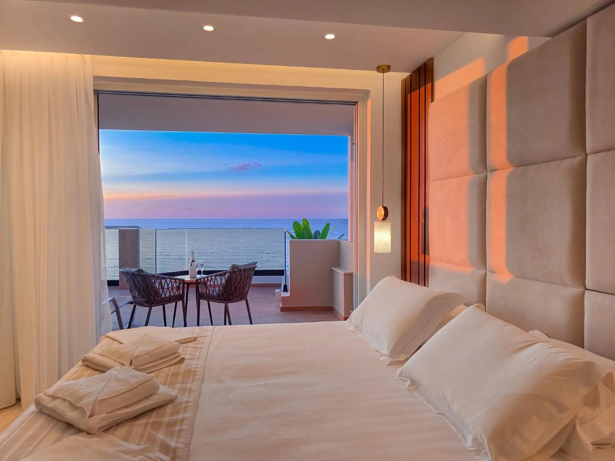 Bed in Theo Beach Hotel Apartments