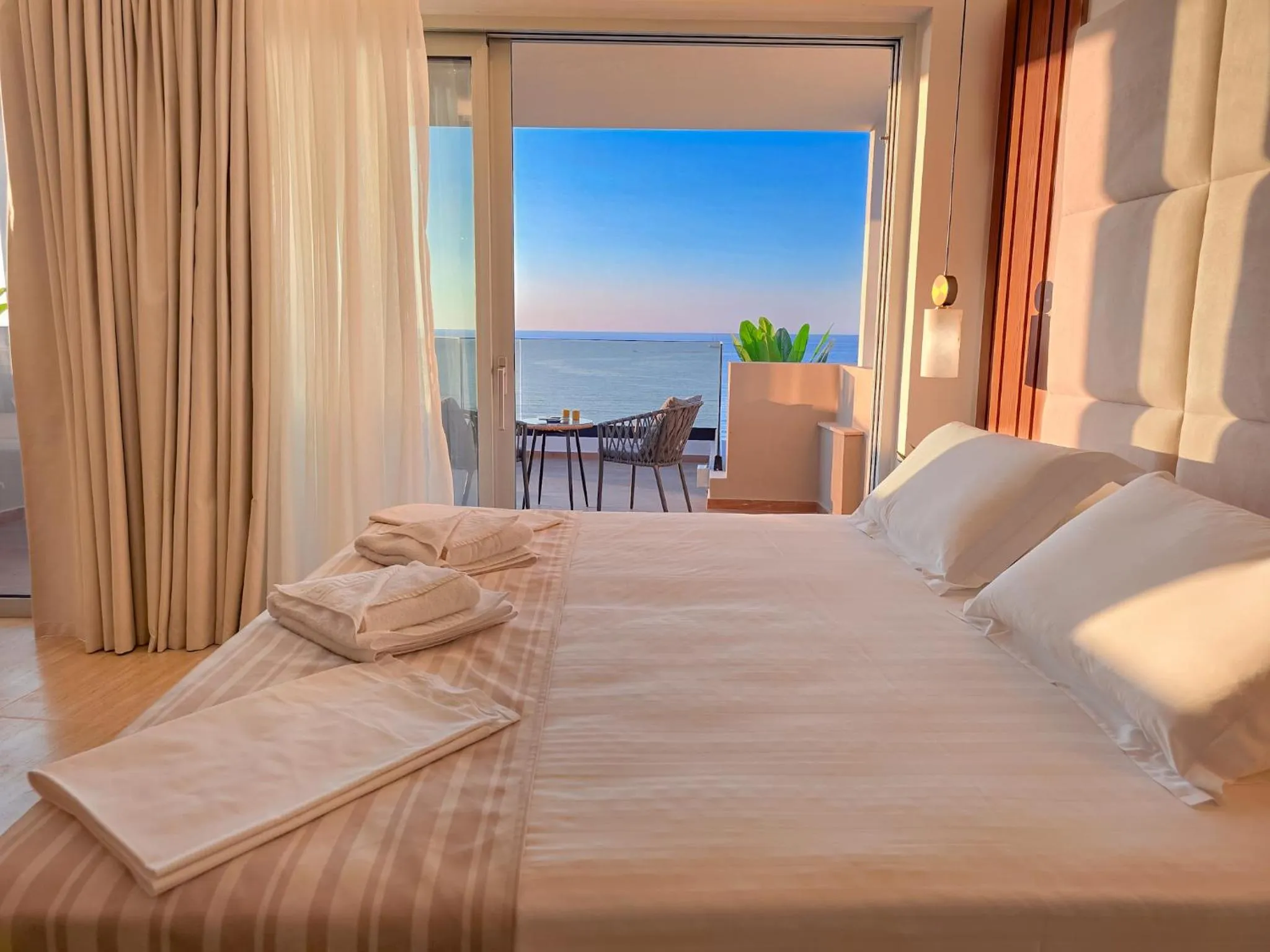 Bed in Theo Beach Hotel Apartments