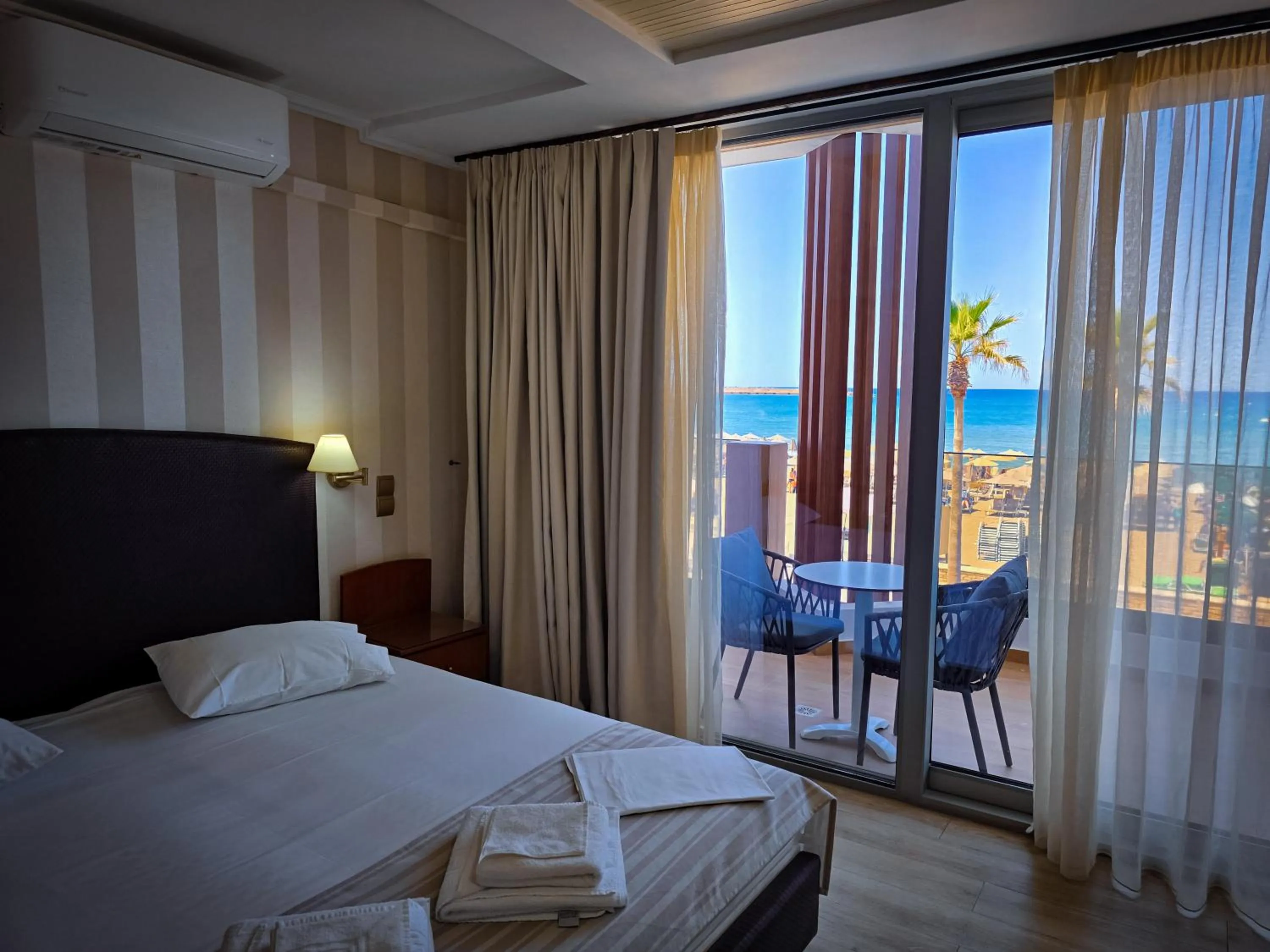 Bed in Theo Beach Hotel Apartments