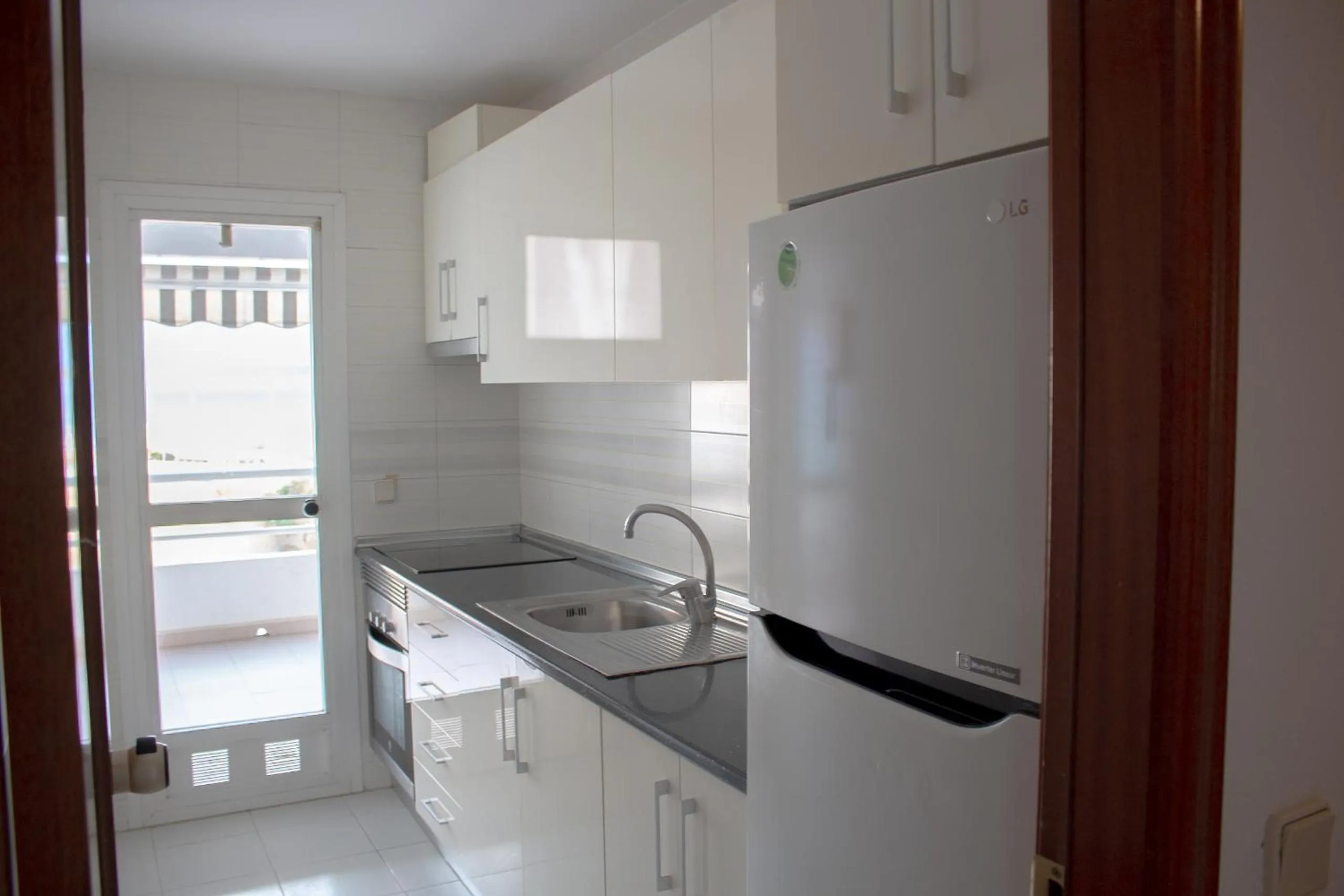 Kitchen or kitchenette in Apartamentos Esmeralda Unitursa