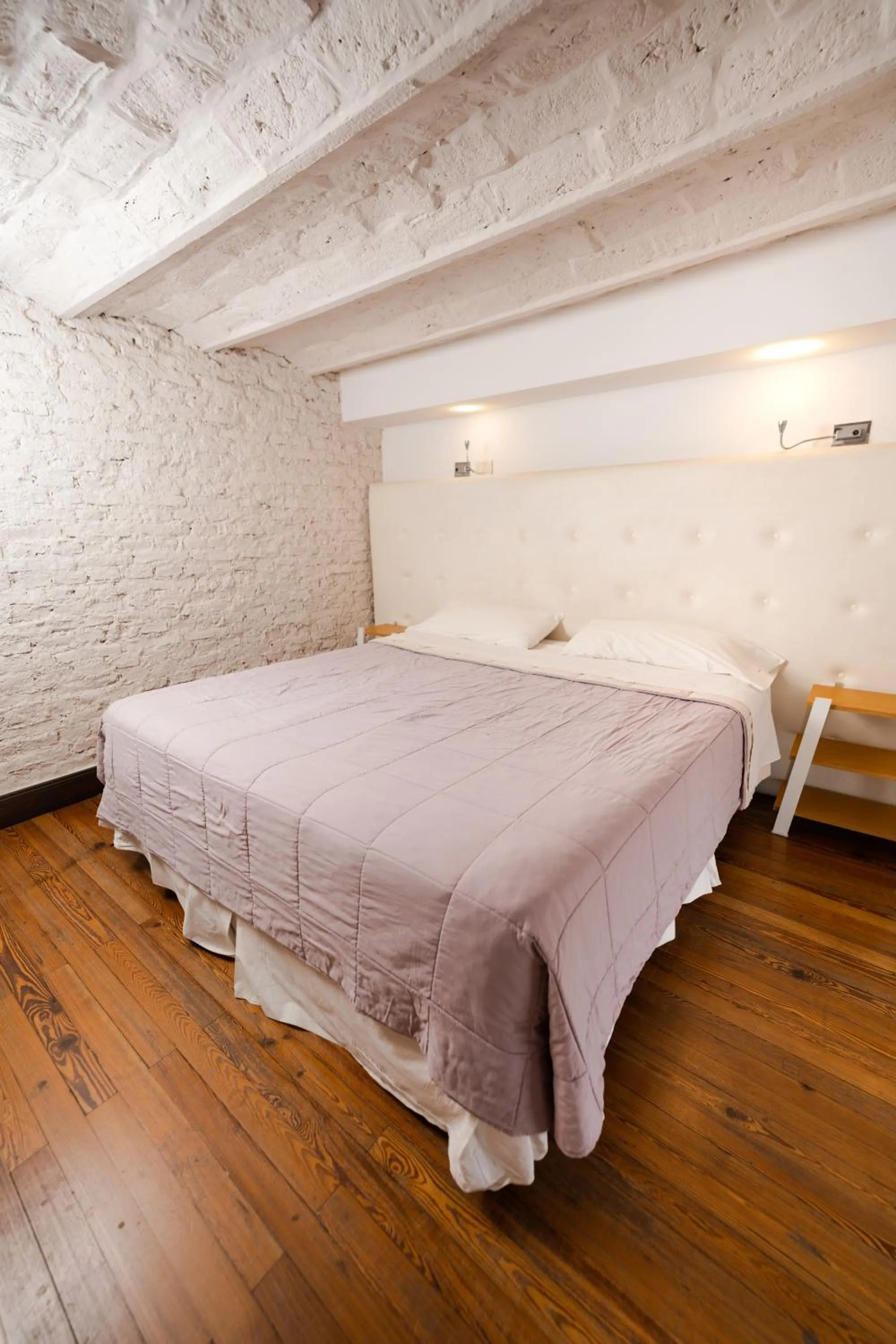 Bed in Loft Osteria by Sagardi