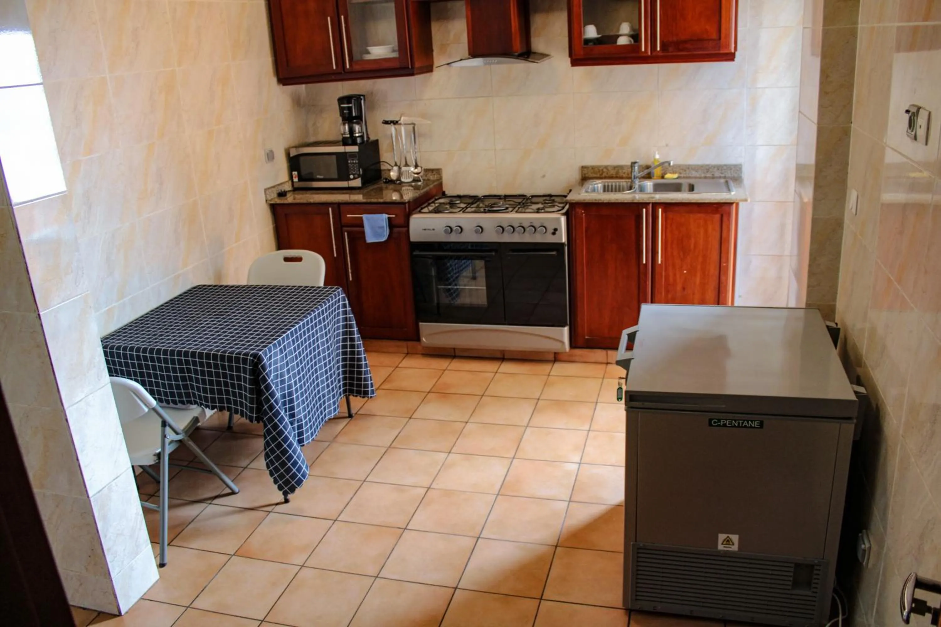 Kitchen or kitchenette in Residence Le Carat Bonapriso