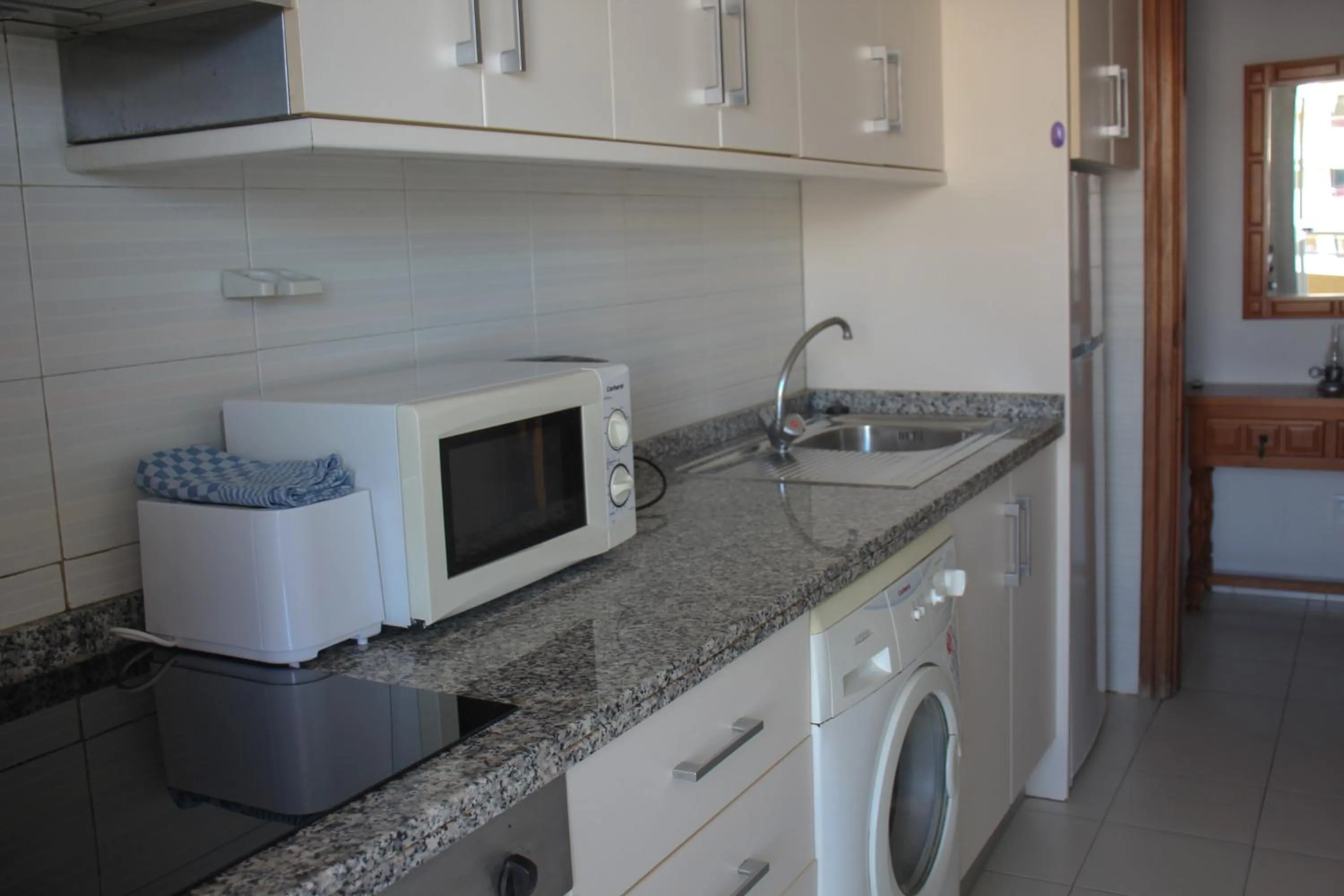 Kitchen or kitchenette in Apartamentos Turmalina Unitursa