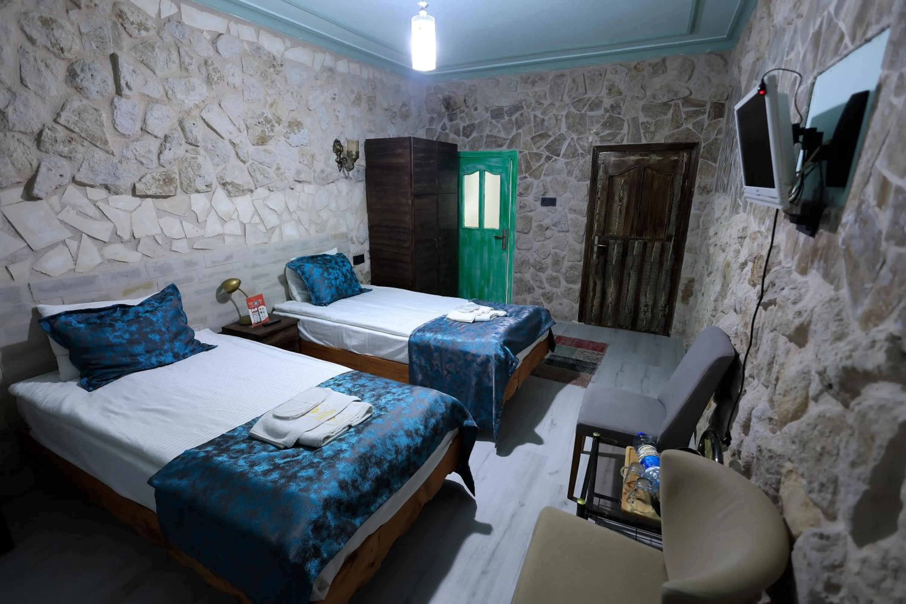 Bed in KEMAL STONE HOUSE HOTEL.