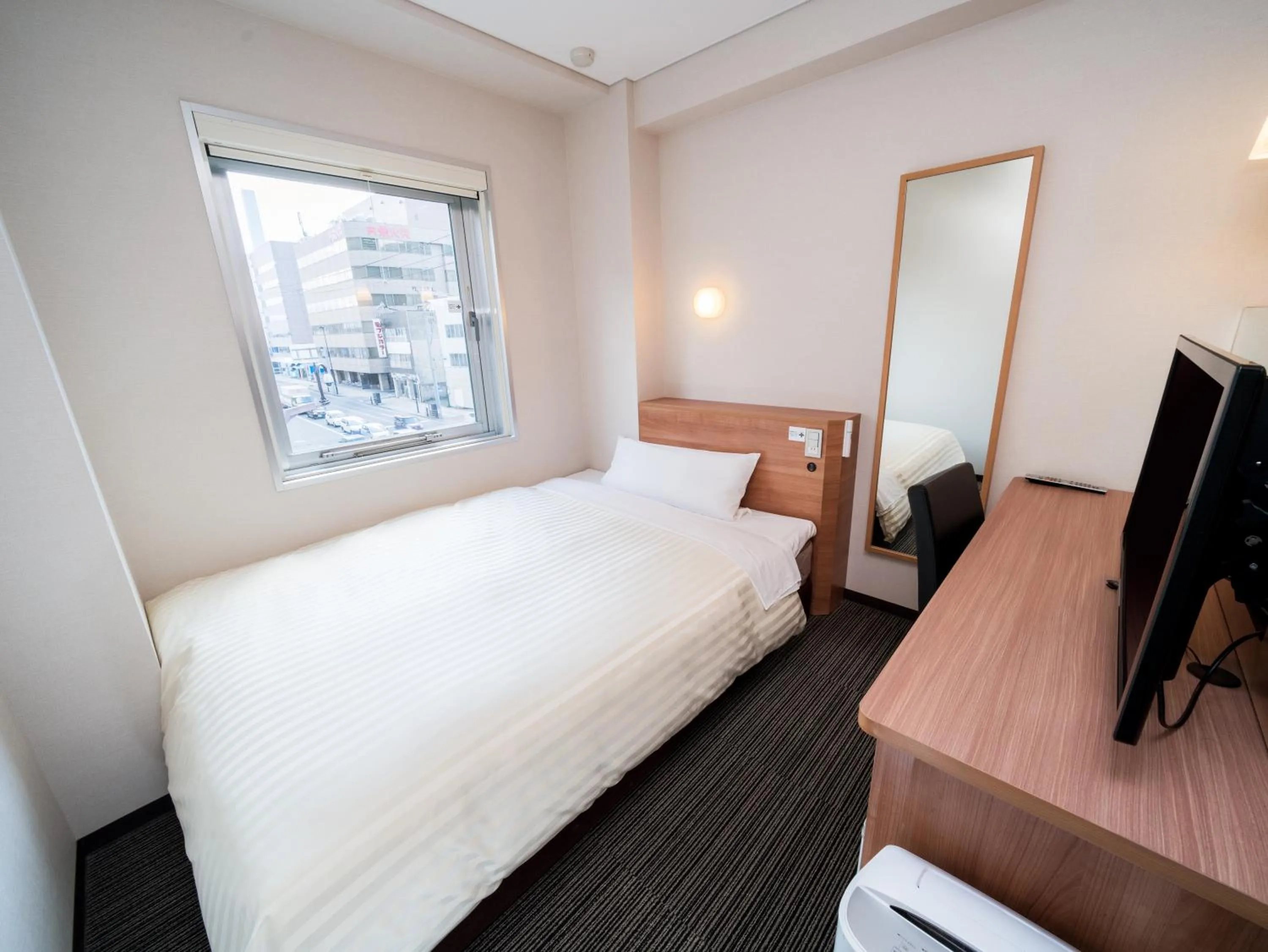 Bed in Super Hotel Aomori