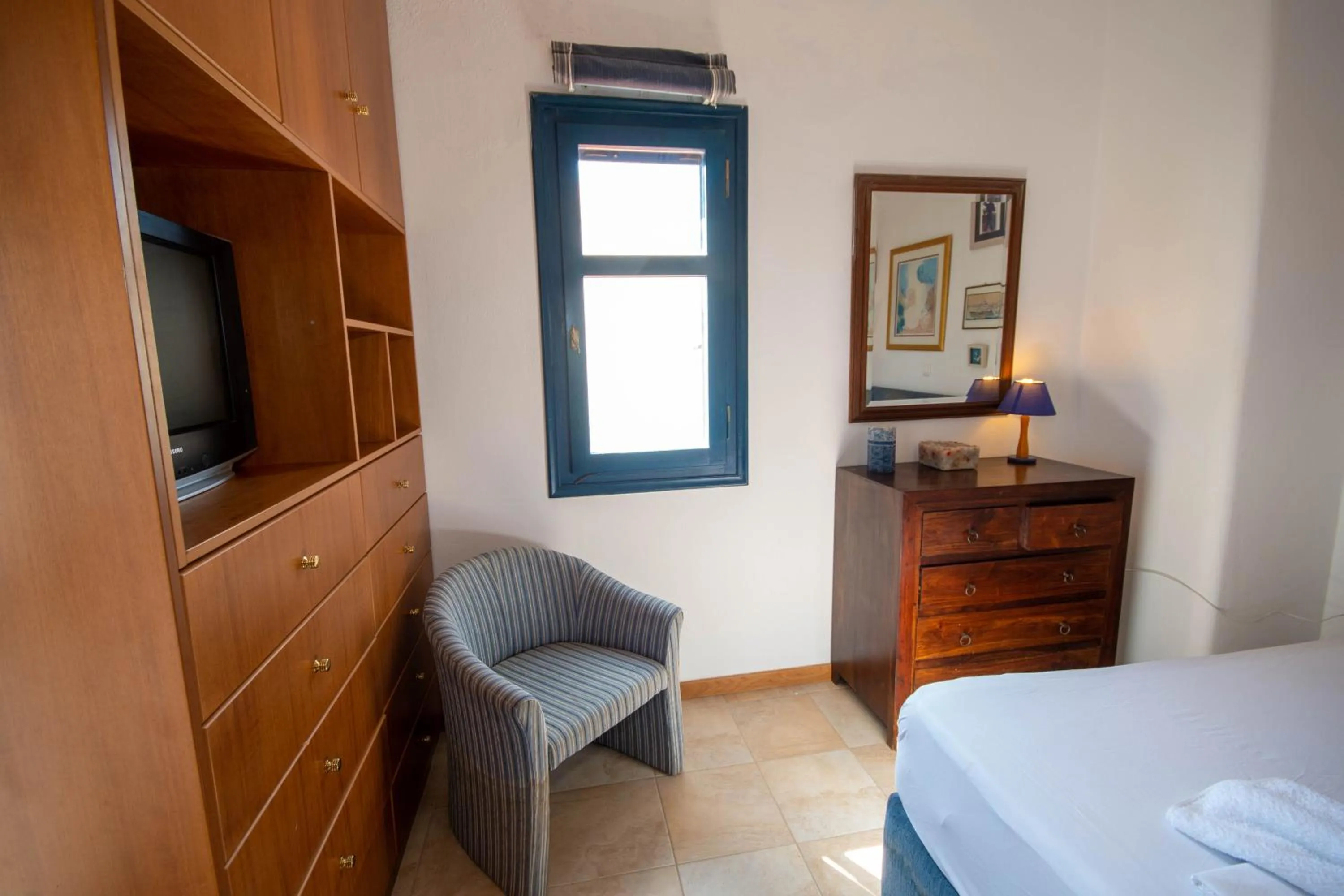 Bed in Triton Authentic Cretan Hotel