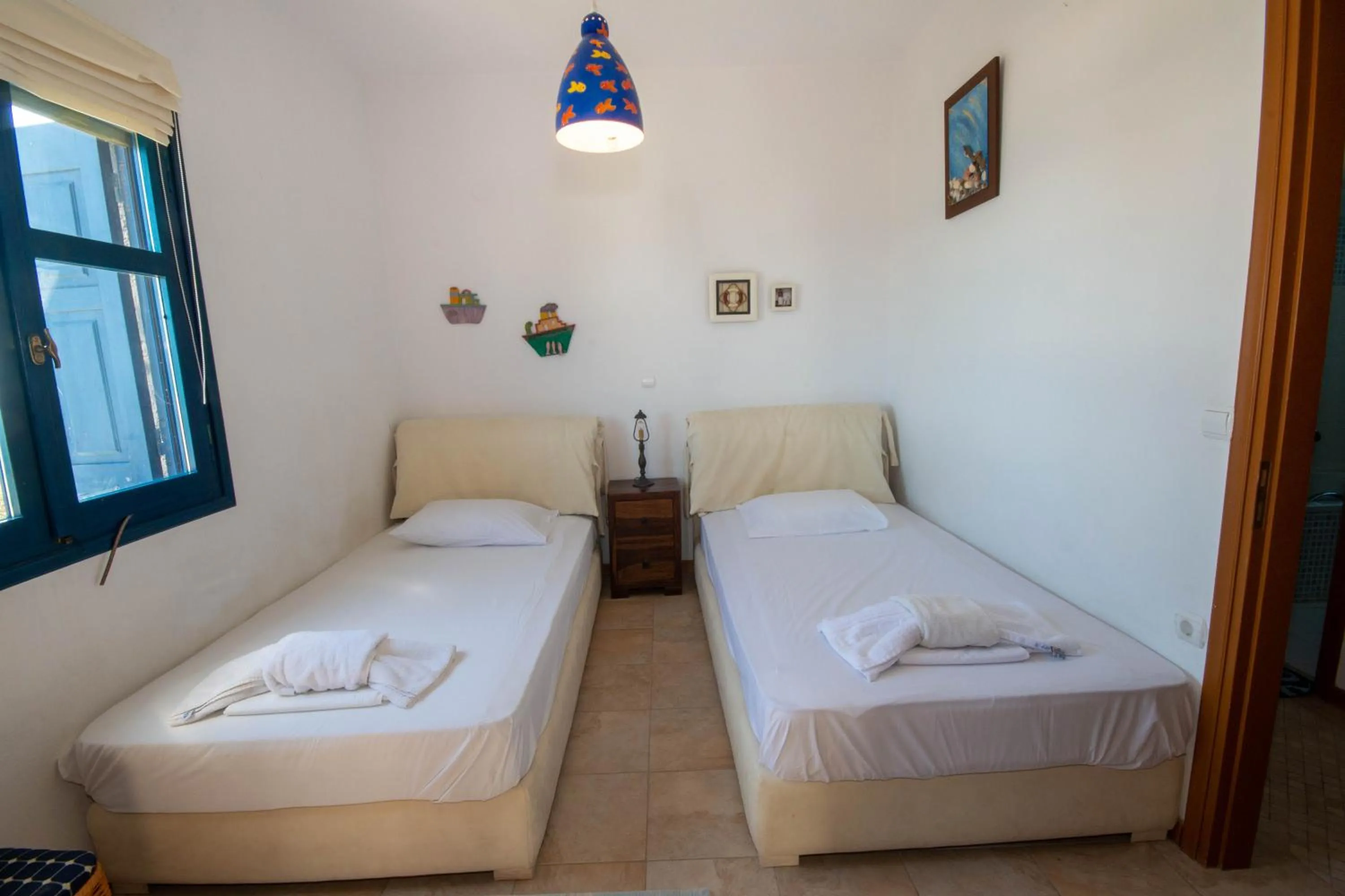 Bed in Triton Authentic Cretan Hotel