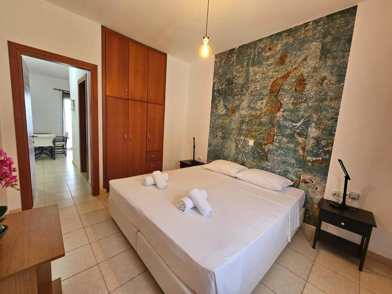 Bed in Triton Authentic Cretan Hotel