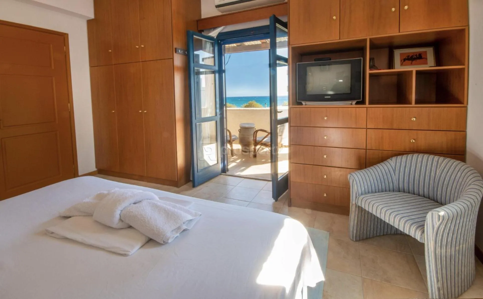 Bed in Triton Authentic Cretan Hotel