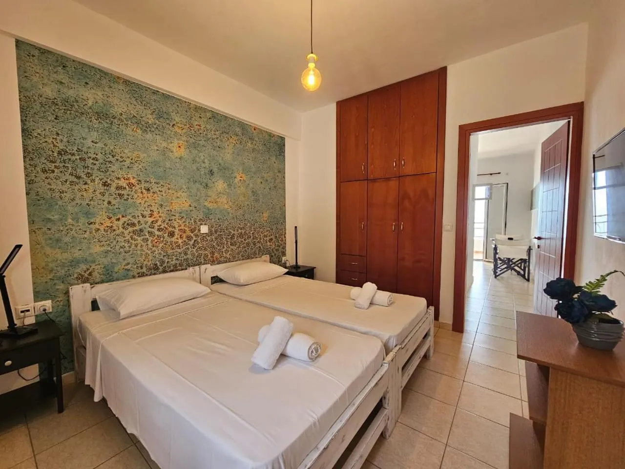 Bed in Triton Authentic Cretan Hotel