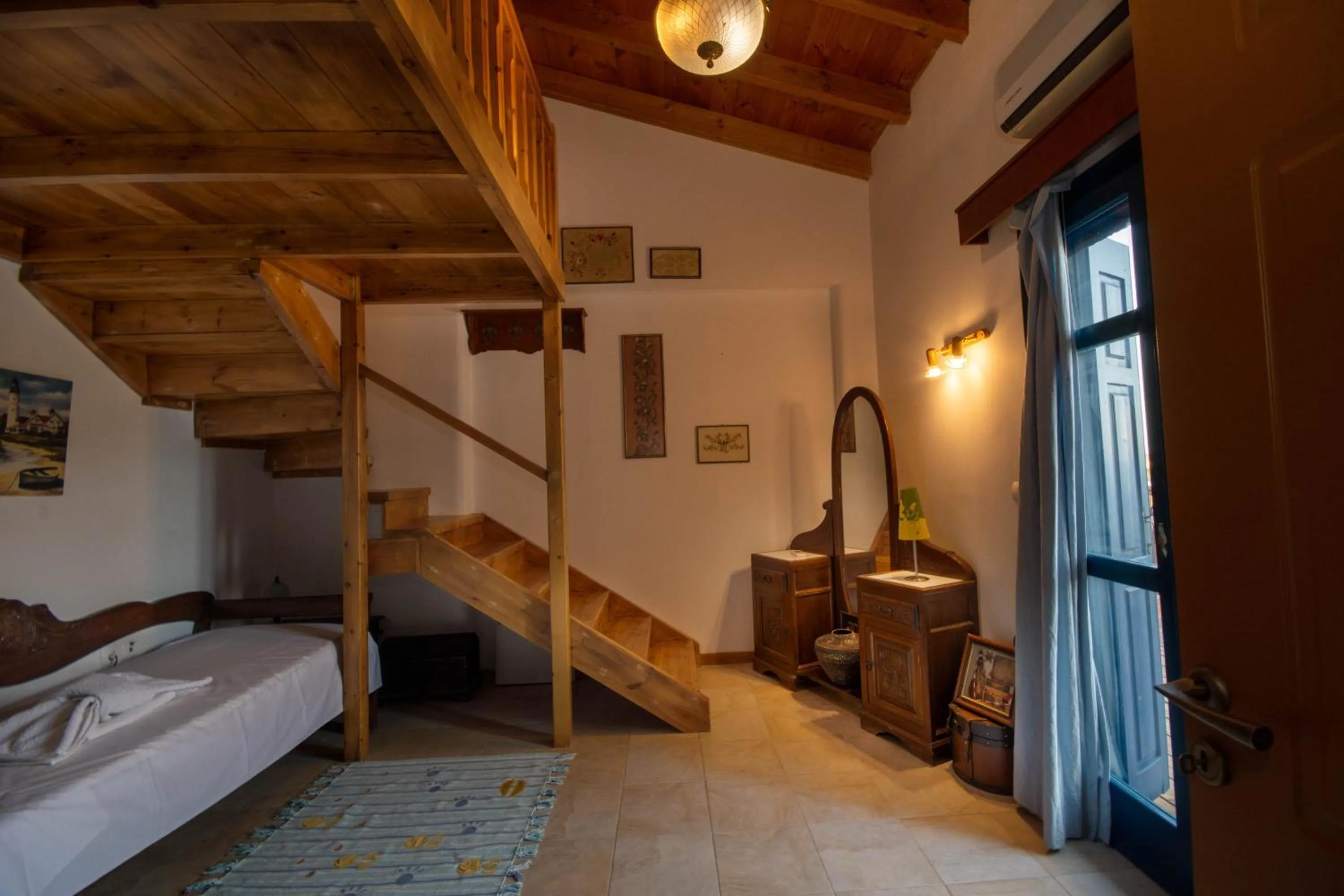 Bed in Triton Authentic Cretan Hotel