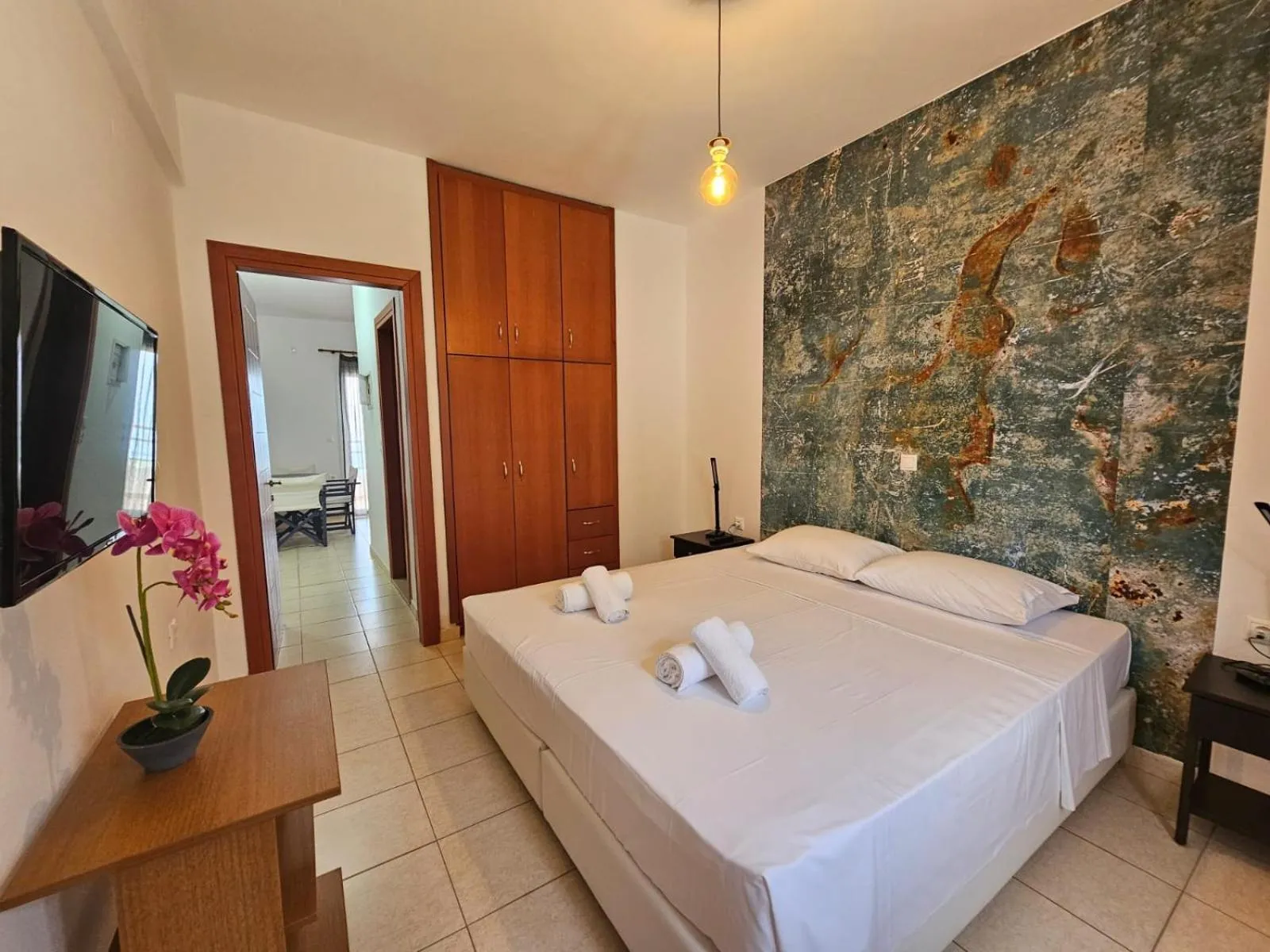 Bed in Triton Authentic Cretan Hotel