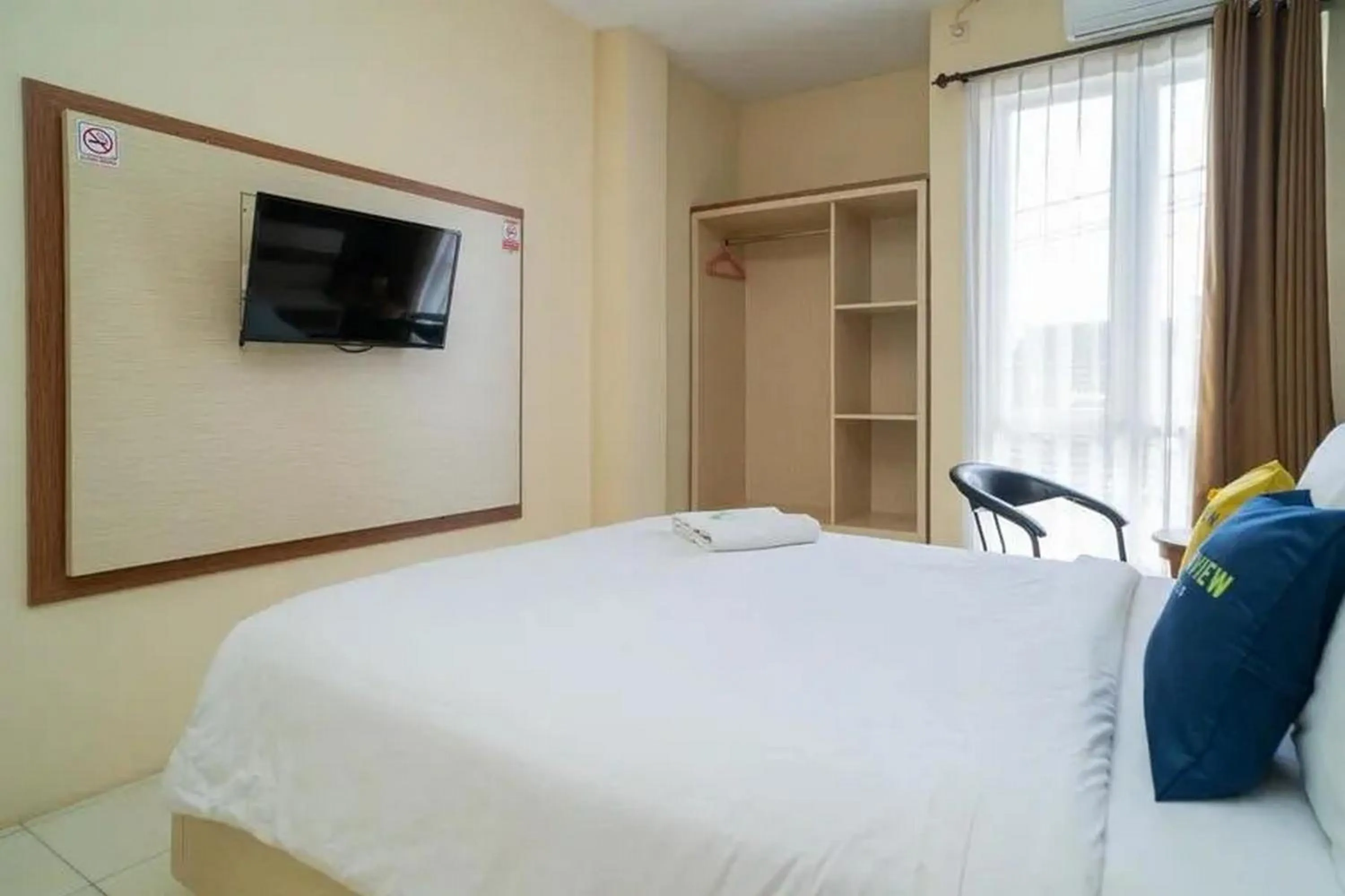 Bed in Urbanview Hotel Omah Anin Batu by RedDoorz