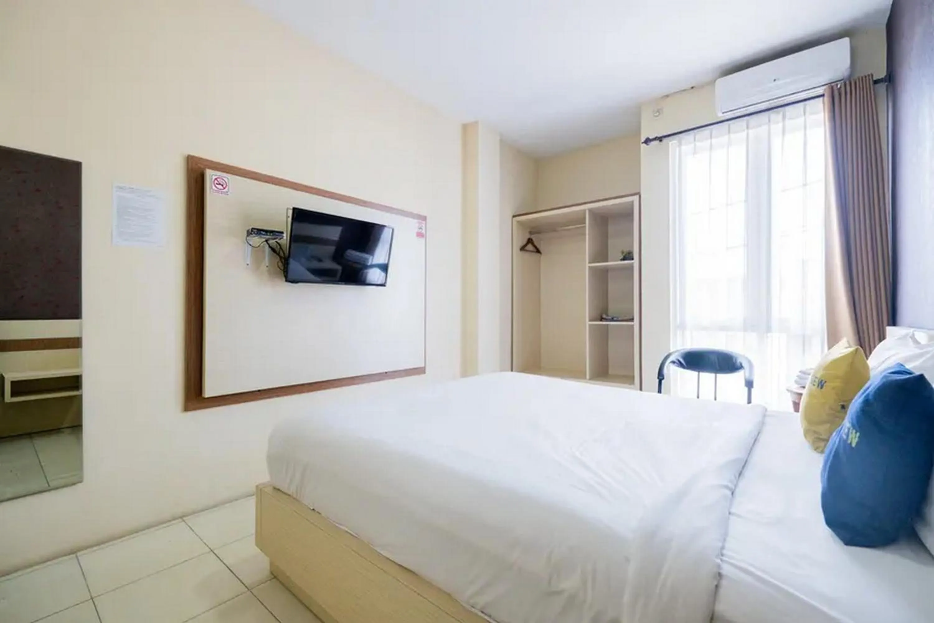 Bed in Urbanview Hotel Omah Anin Batu by RedDoorz