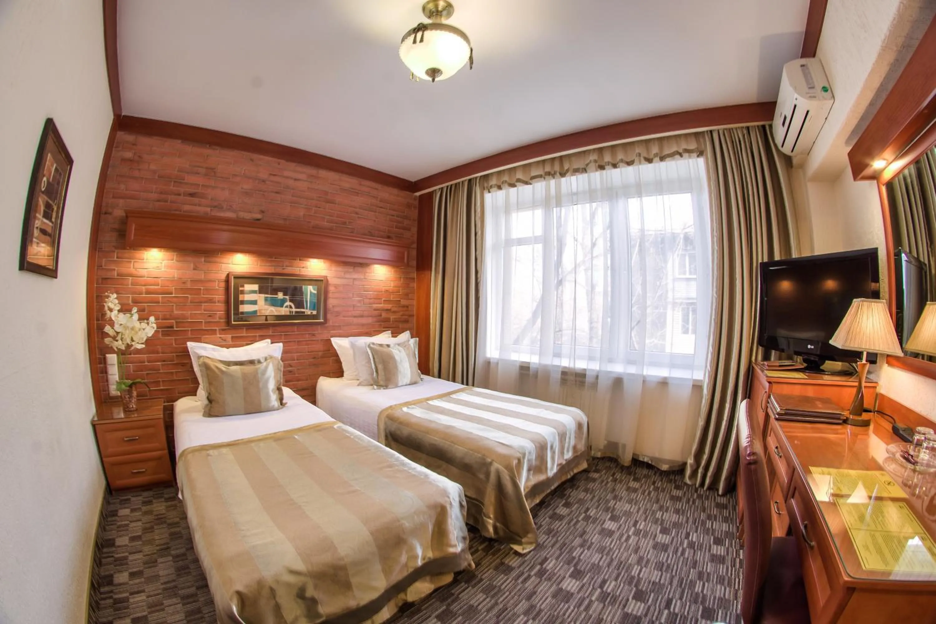 Bed in Hotel Uyut Almaty