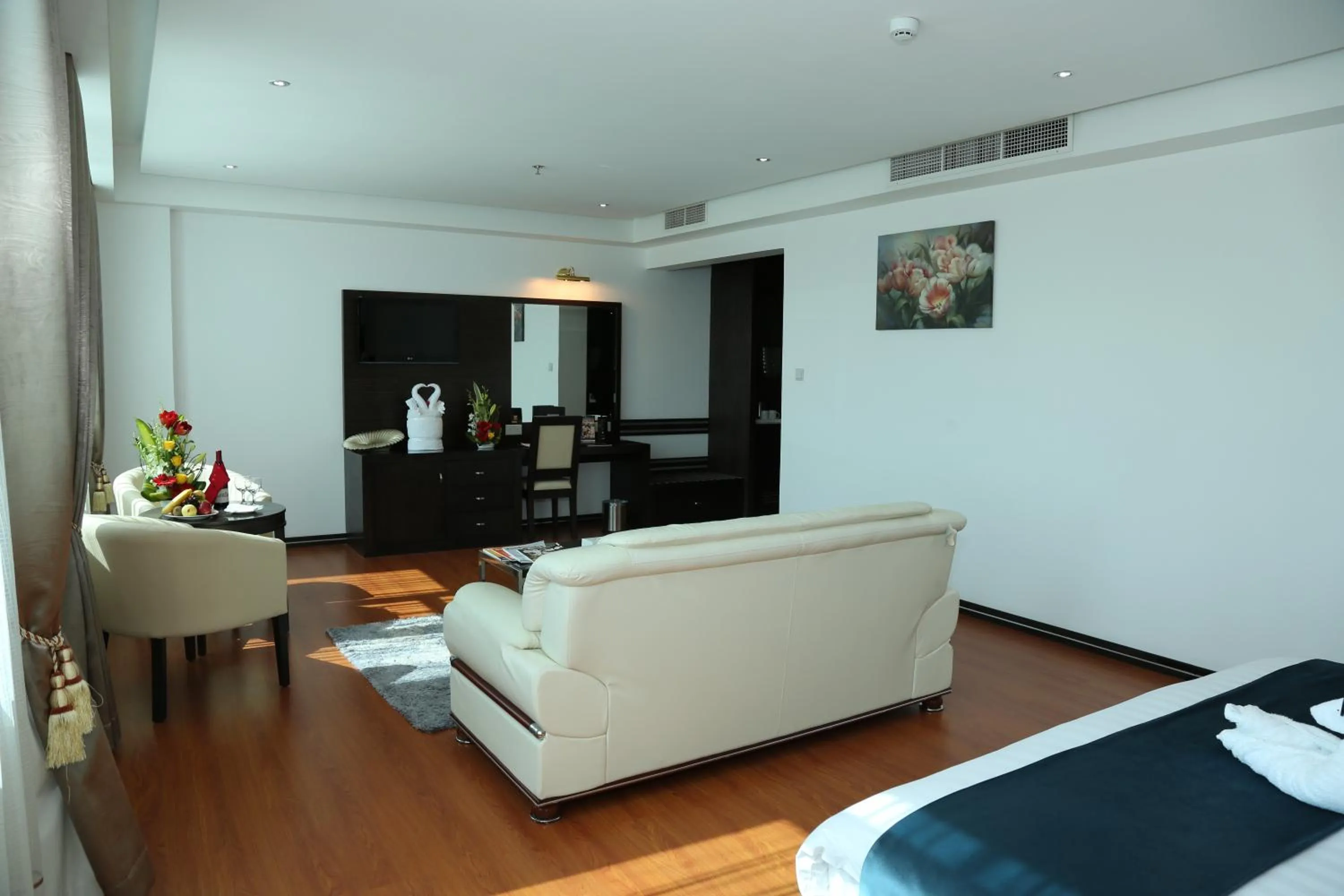 Seating area, Bed in The Olive Hotel, Juffair