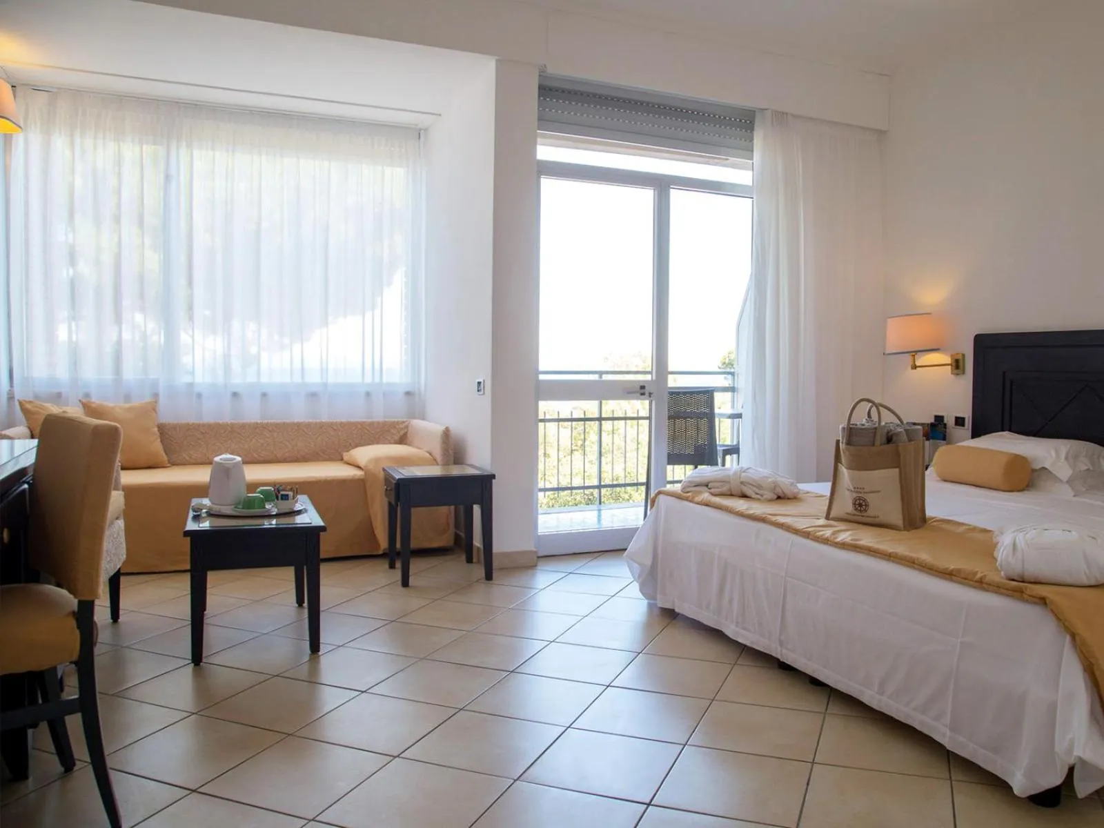 Seating area, Bed in JR Resort Elba International