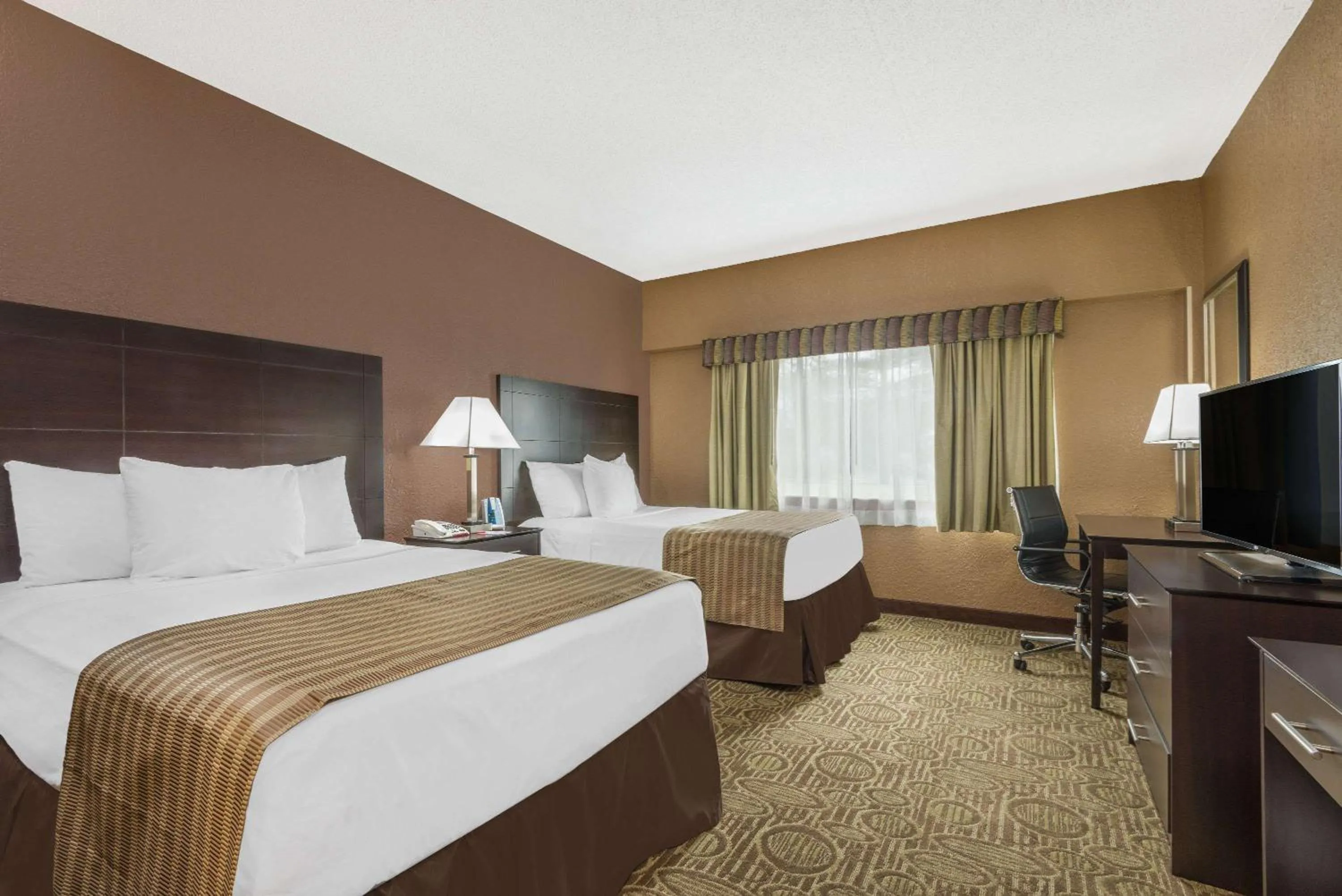 Photo of the whole room, Bed in Ramada by Wyndham Paintsville Hotel & Conference Center