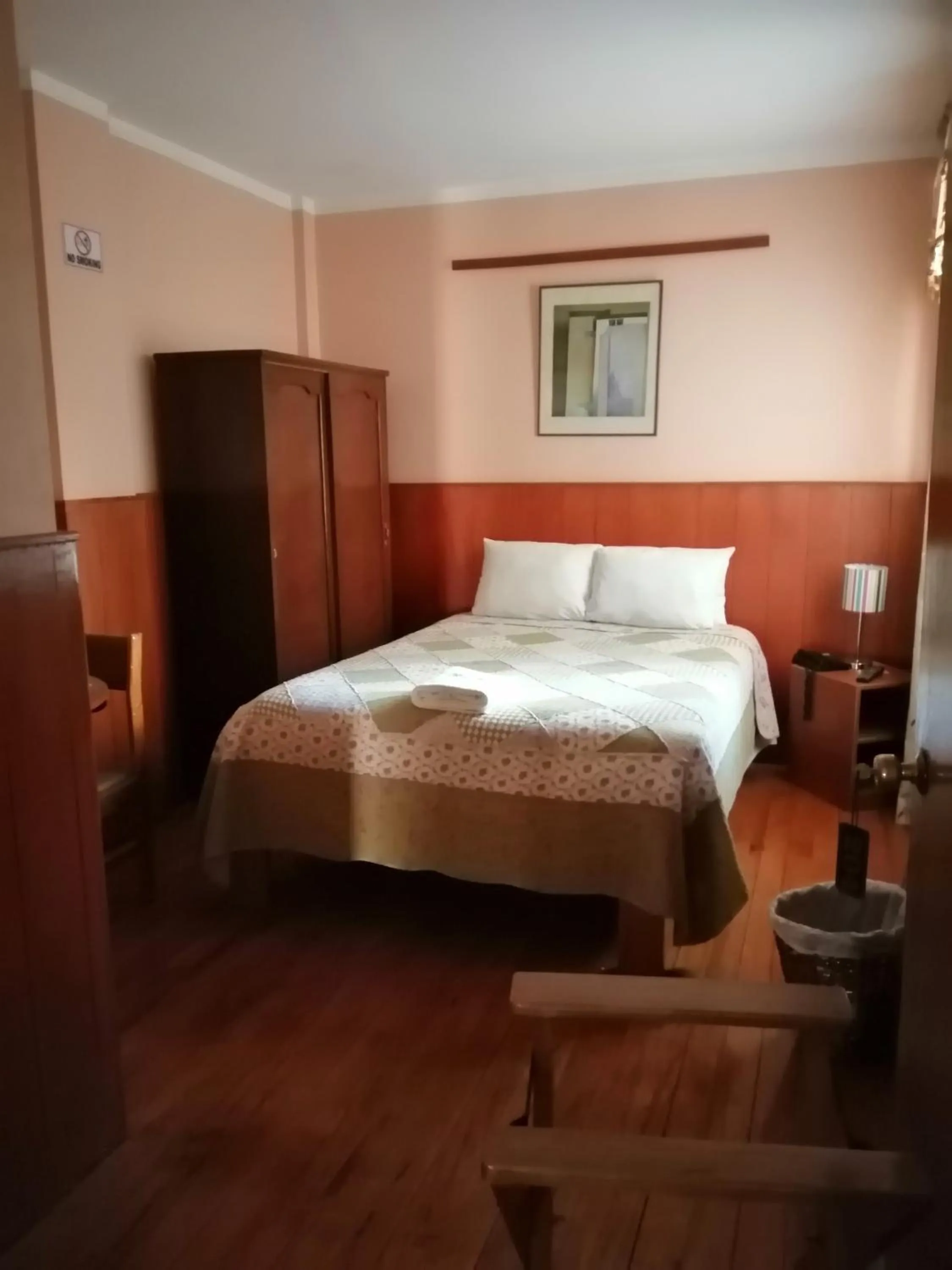 Bed in Huaytusive Inn Hotel