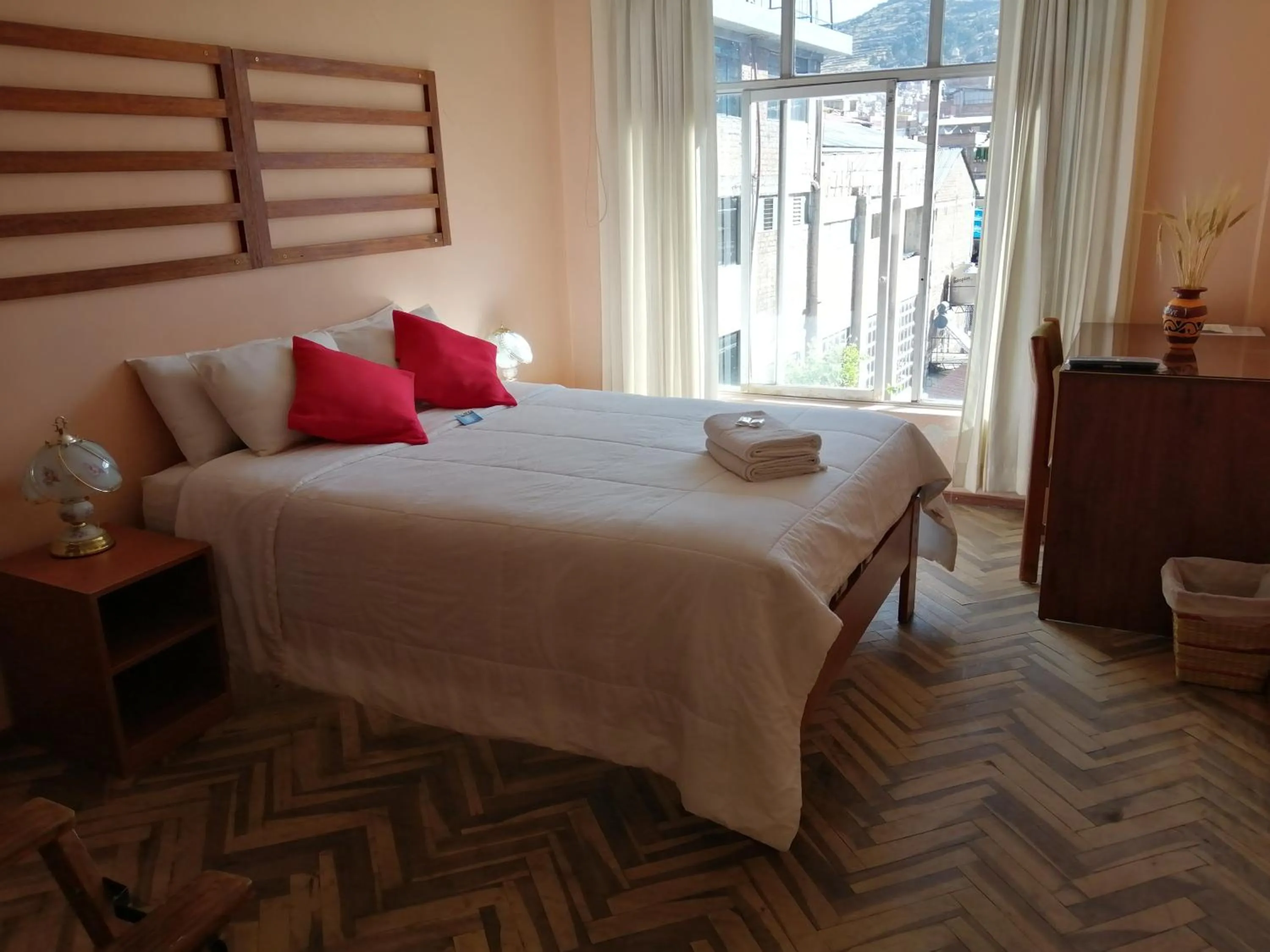 Bed in Huaytusive Inn Hotel