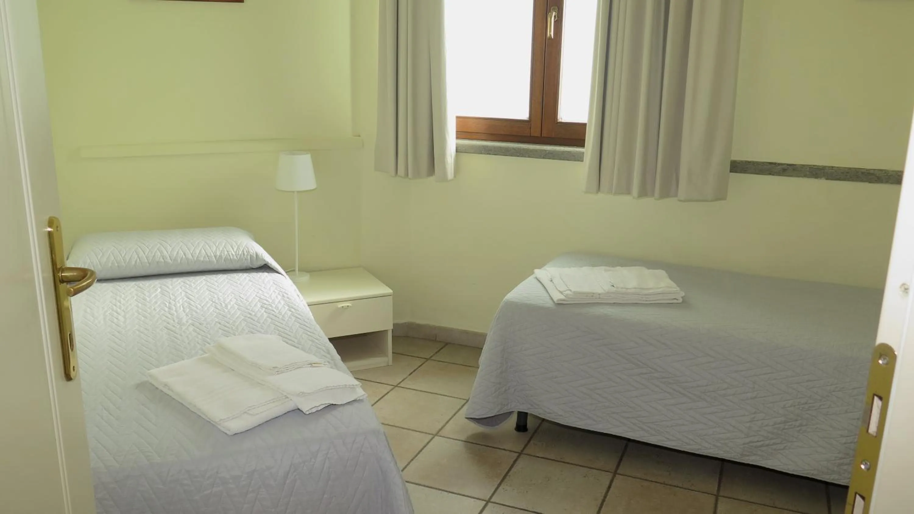 Bedroom, Bed in Residenza Turistico Alberghiera Corallo