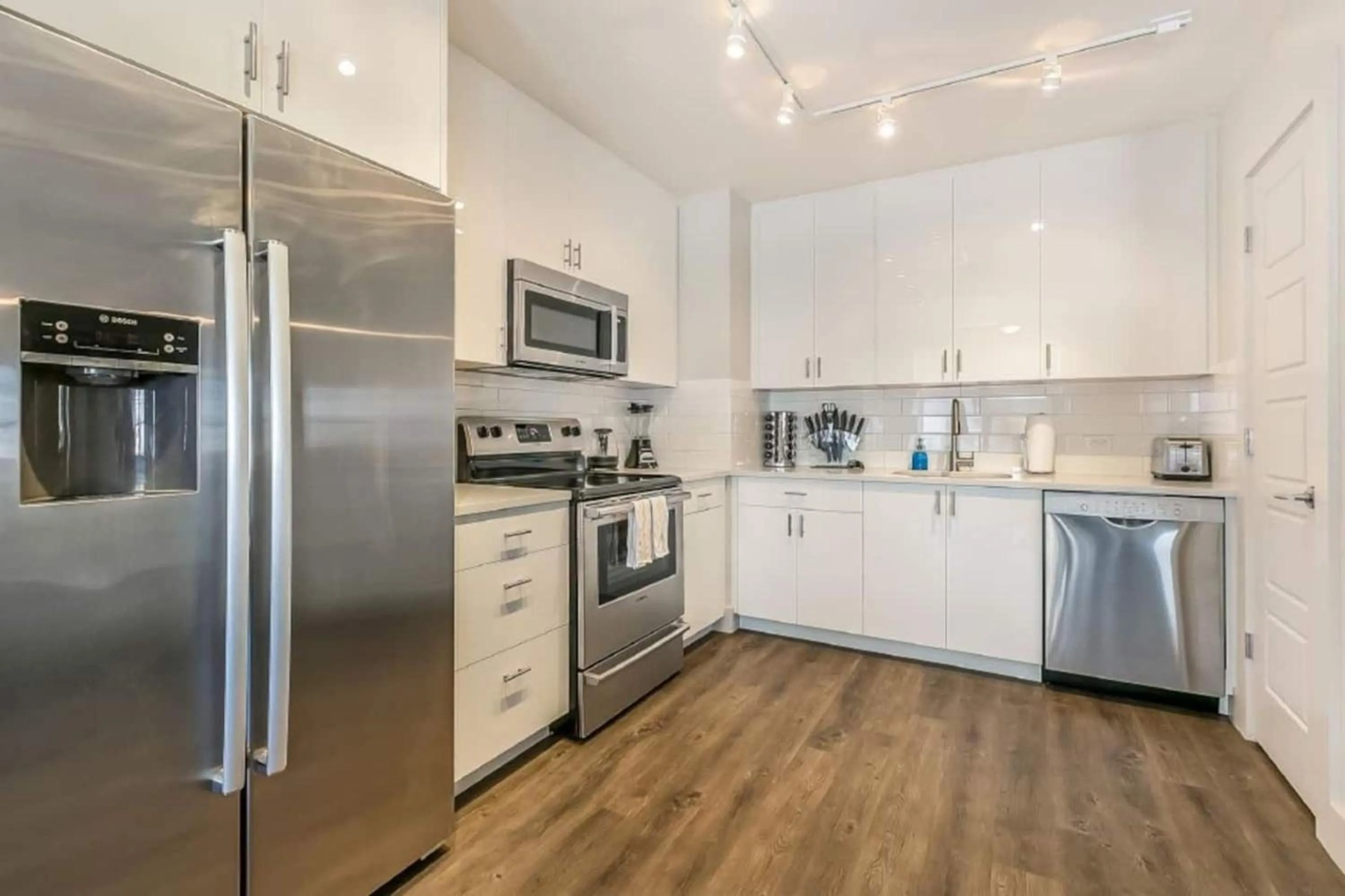 Kitchen or kitchenette in Modern & Fully Furnished Apartments in the Heart of the City