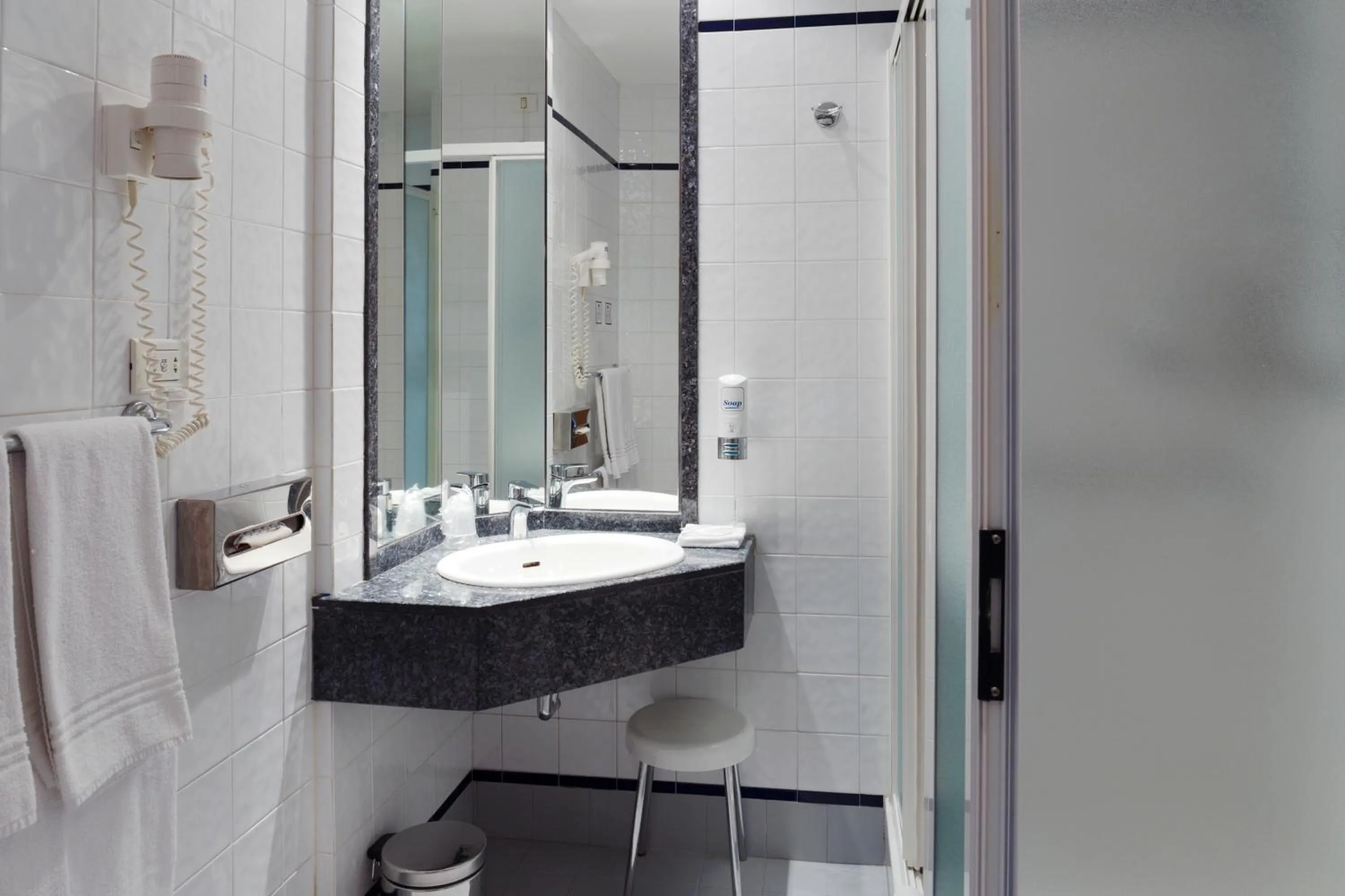 Bathroom in City Hotel & Suites