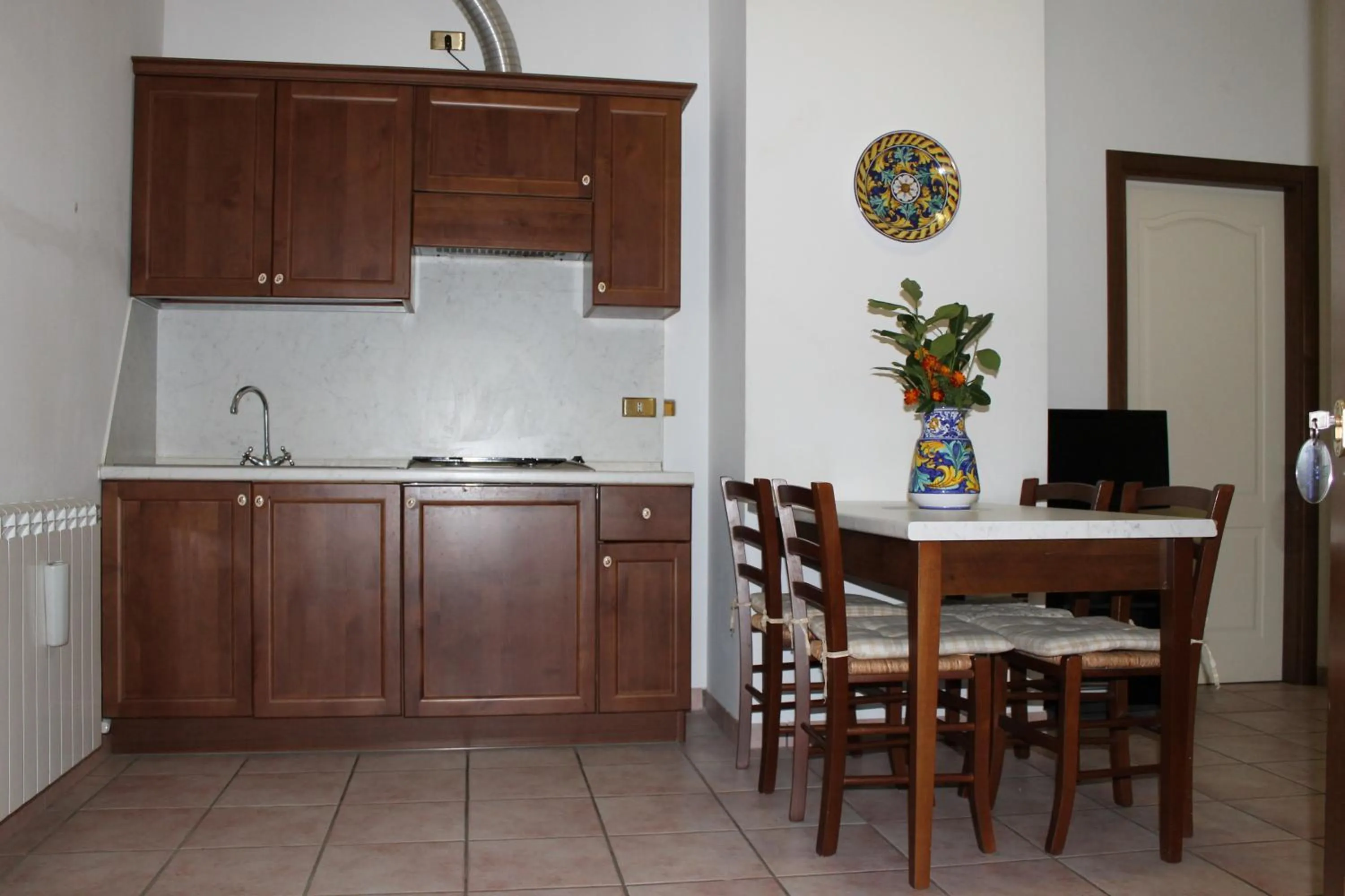 Kitchen or kitchenette in Residence La Piscina