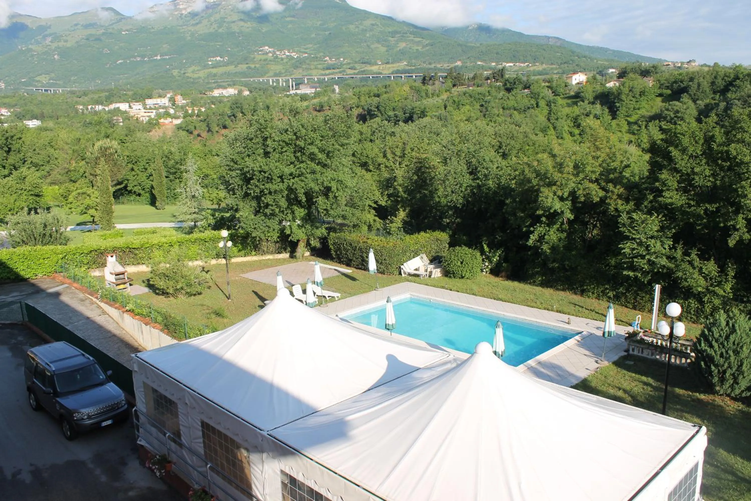 Garden view in Residence La Piscina